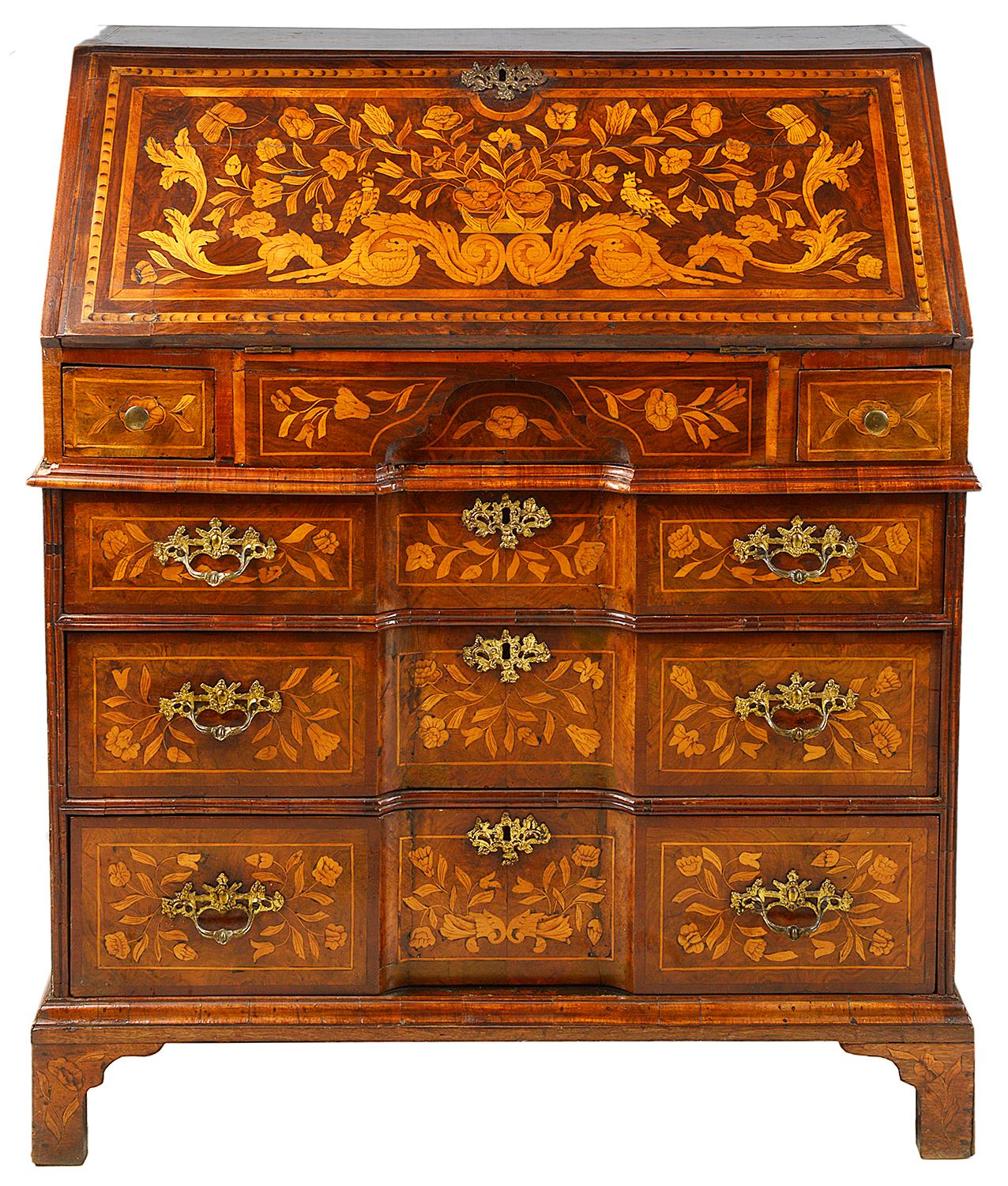 A very good quality 18th century Dutch marquetry walnut bureau, having floral inlaid decoration, the fall front opens to reveal drawers, pigeon holes and a well.
Two small drawers pull out to support the fall, three further graduating, re-entrant