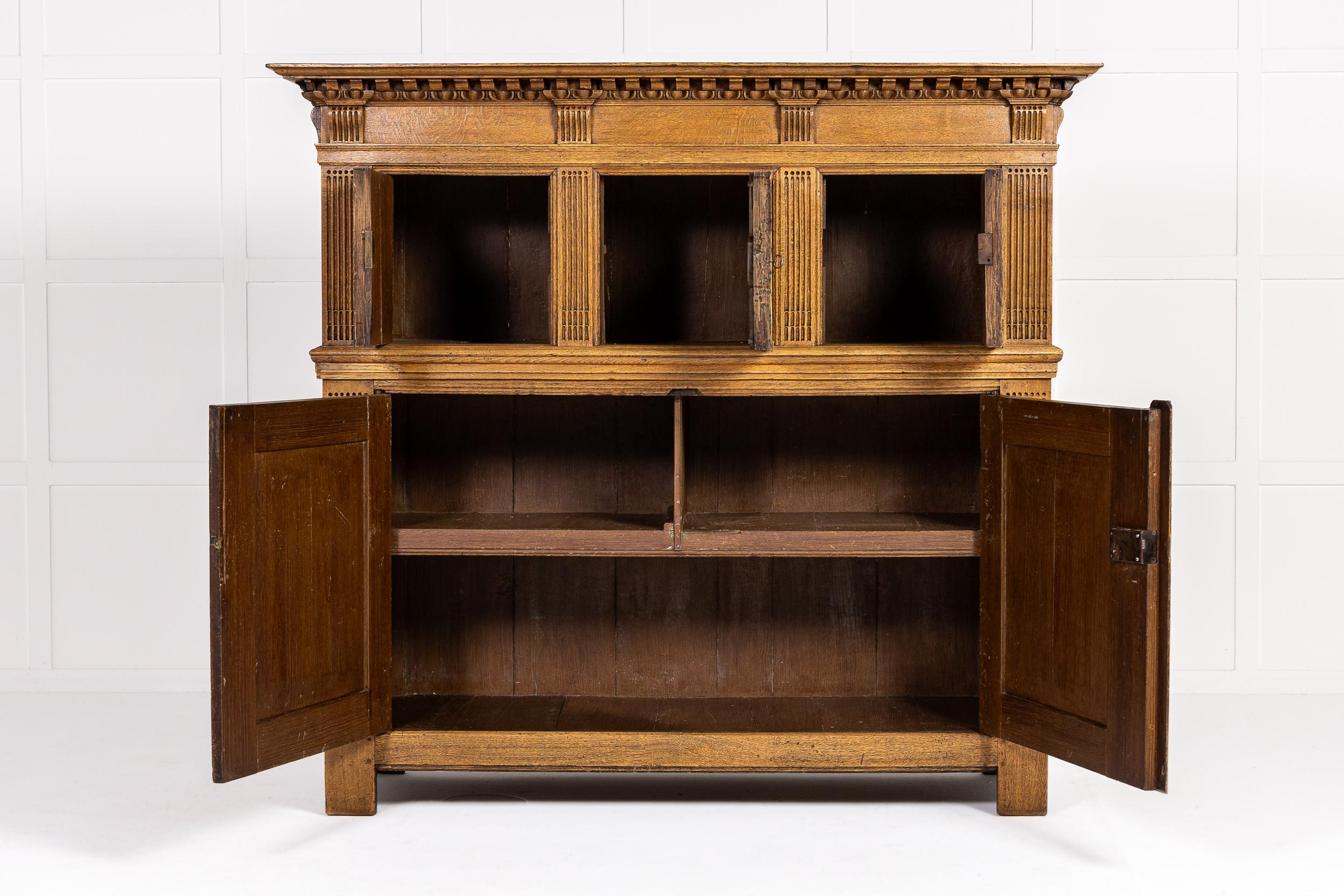 A Splendid 18th Century Dutch Oak Cabinet of Panelled Form.

This interesting cabinet is of 18th century date and Dutch manufacture and the oak is of light tone and colour. Distinctly architectural in its inspiration, this piece of furniture has a