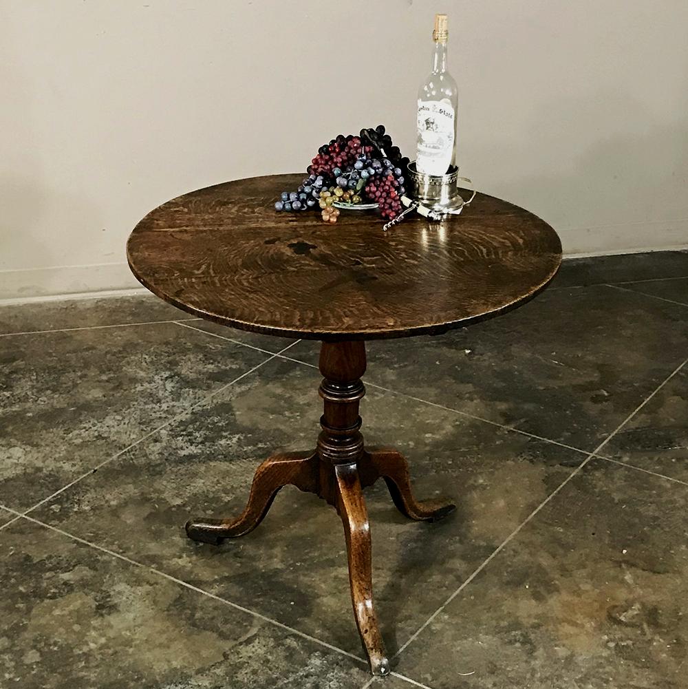 18th century Dutch oak tilt-top end table is an English design, and ideal for providing a convenient end table or lamp table, then with the top tilted it has the ability to tuck against the wall to allow easier passage. The baluster leg have been