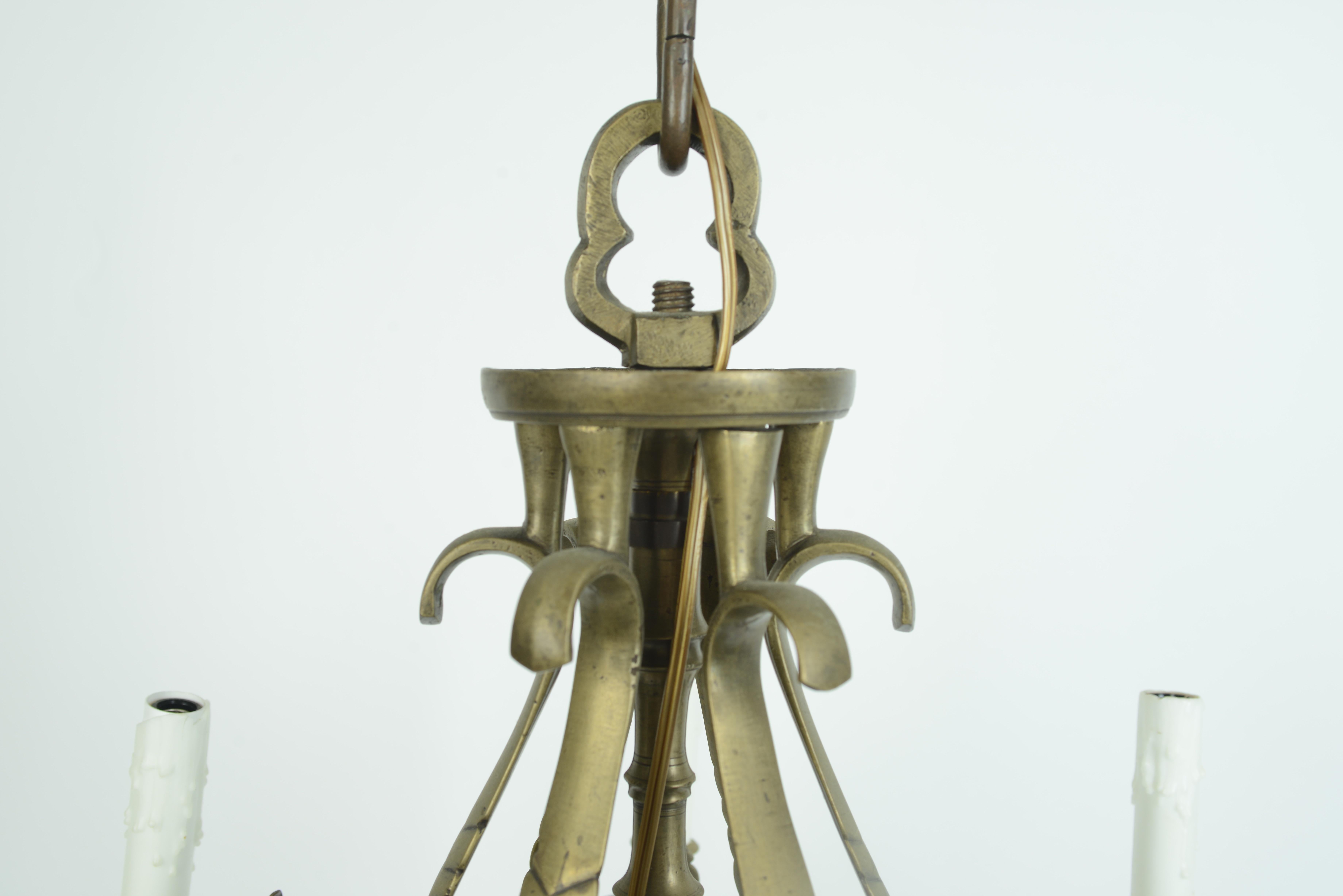 18th century Dutch open pineapple shaped central support brass chandelier with 6-light. Chandelier has been wired and has 6 candelabra bulbs.
N.P. Trent has been a respected name in antiques for over 30 years with a large collection of period