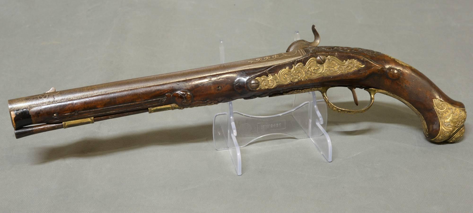 A fine quality 18th century Dutch or German holster pistol, circa 1770.

Converted into percussion, circa 1830.
    