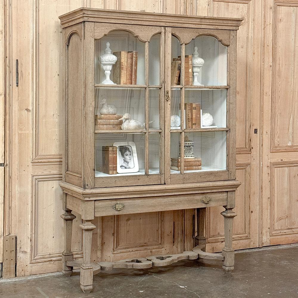 18th Century Dutch Raised Cabinet ~ Bookcase in Stripped Oak combines stately lines with a casual presence that makes it versatile for a wide variety of decors!  The stripped oak finish presents a soft texture and color while the interior display is