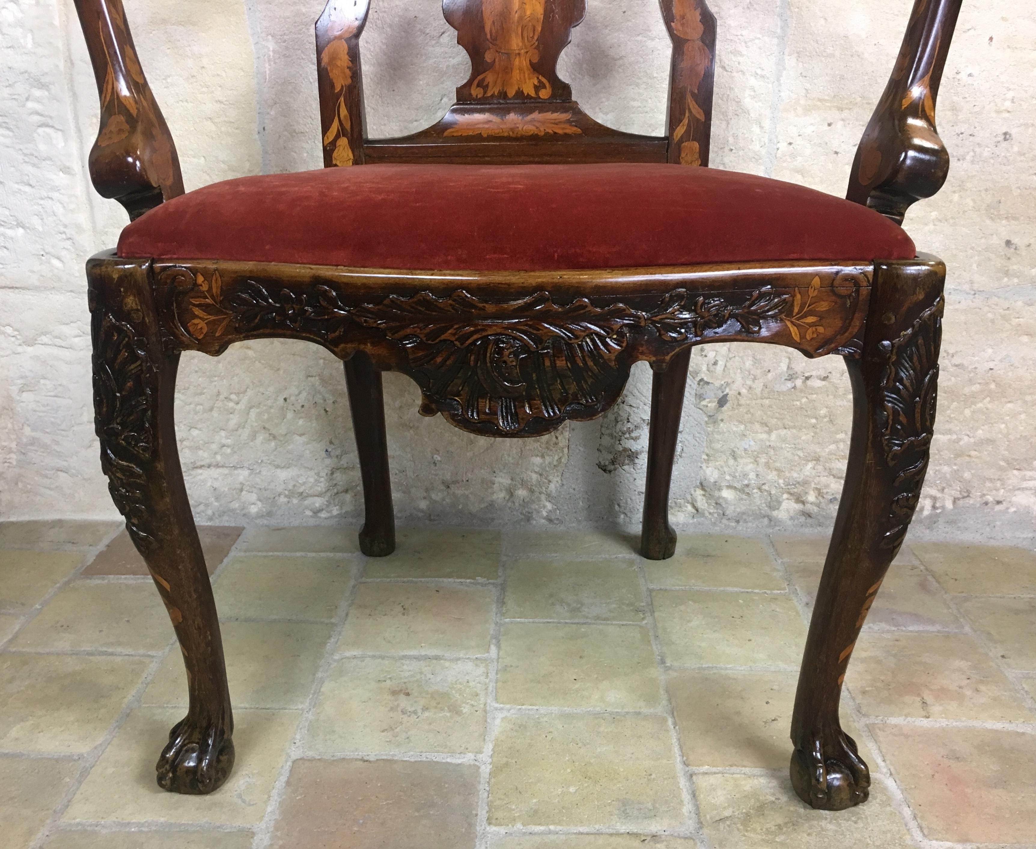 This is a rare Dutch marquetry arm chair that has lived a long life and is now ready to show itself off in just that right spot in your home. The satinwood inlay work on this chair is remarkable and intact. 

The chair sits on Queen Anne style legs