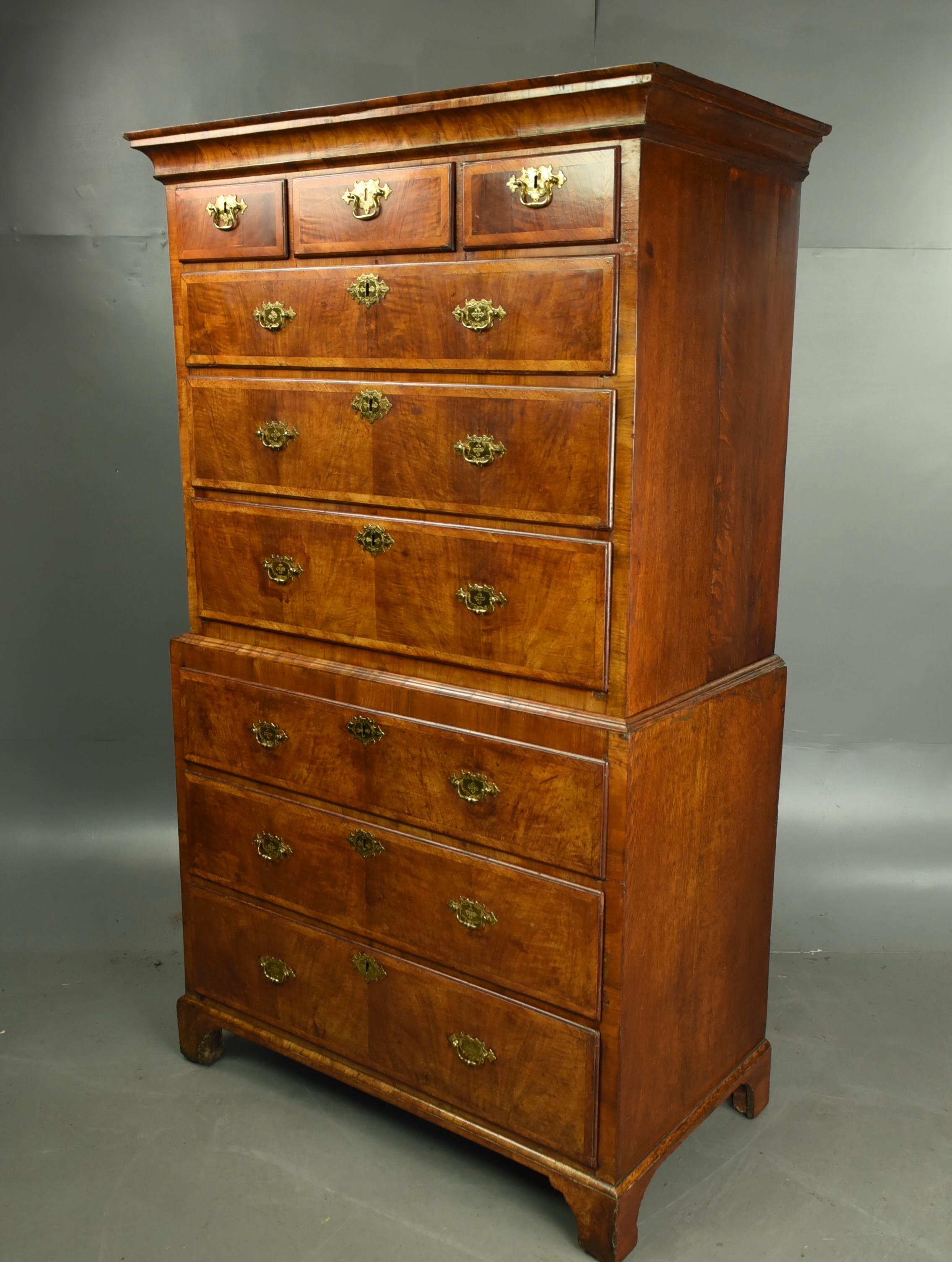 Early 18th century very fine and grand example of a walnut chest on chest/tallboy. The cavetto cornice above an arrangement of three short and three long drawers to the top half, , above the base and a further arrangement of  three long drawers