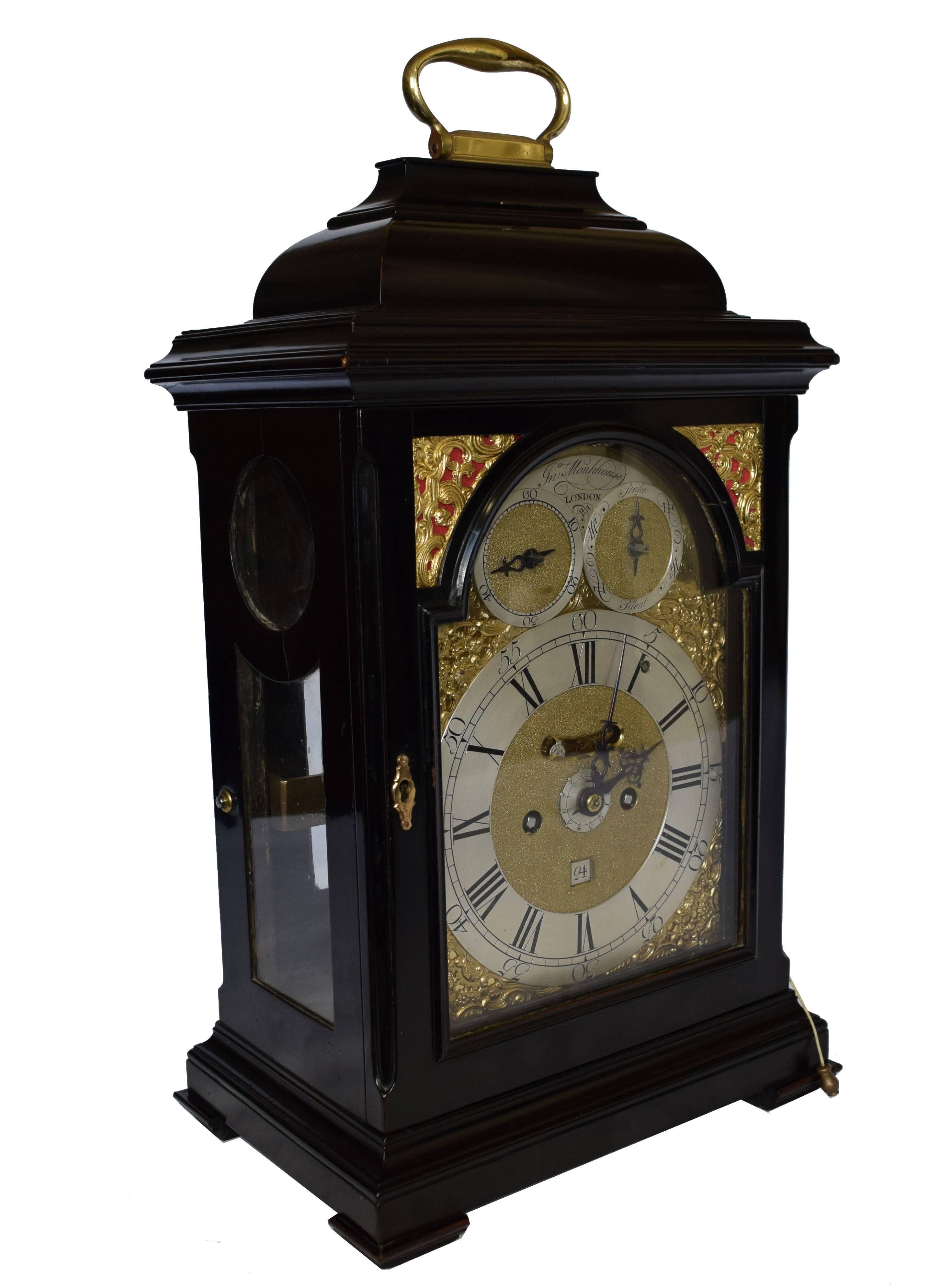 18th century ebonized bracket clock by John Monkhouse

Measure: Height 51 x width 28.2 x depth 19 cm

John Monkhouse of London (1756-1770; active)

The inverted bell top case over glazed side panels and arched brass door on small plinth with