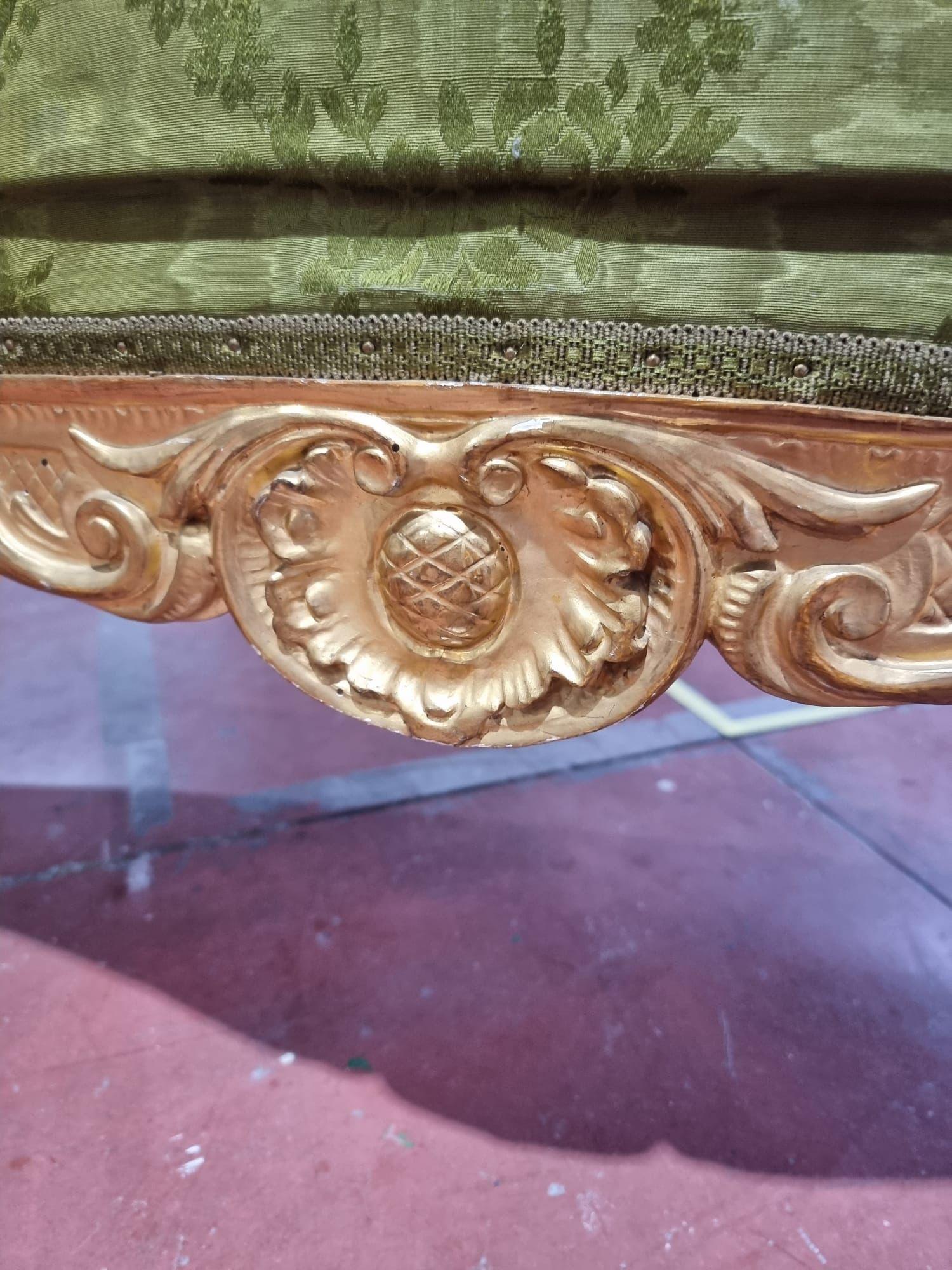 Elegant sofa in carved and gilded wood. The piece of furniture comes from an important Florentine residence. The carvings and pure gold gilding are of excellent workmanship, circa 1860, Florence.

The upholstery is original but is worn on the seat.