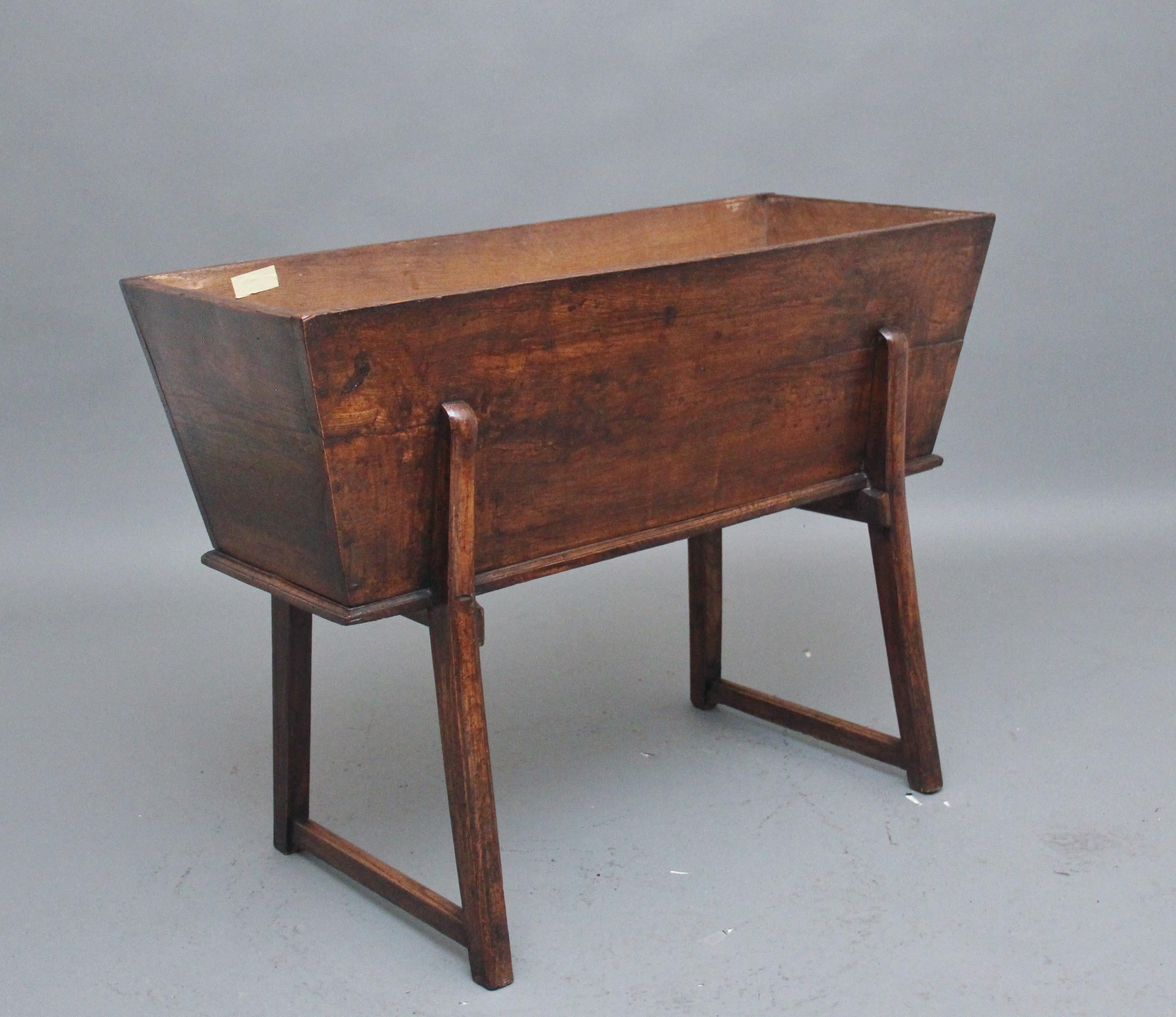 A nice quality 18th Century elm dough bin, the main body section having a lift off lid to reveal a large compartment space which is ideal for storage, with the lid on it can be used as an occasional table, resting on end stretcher supports, lovely