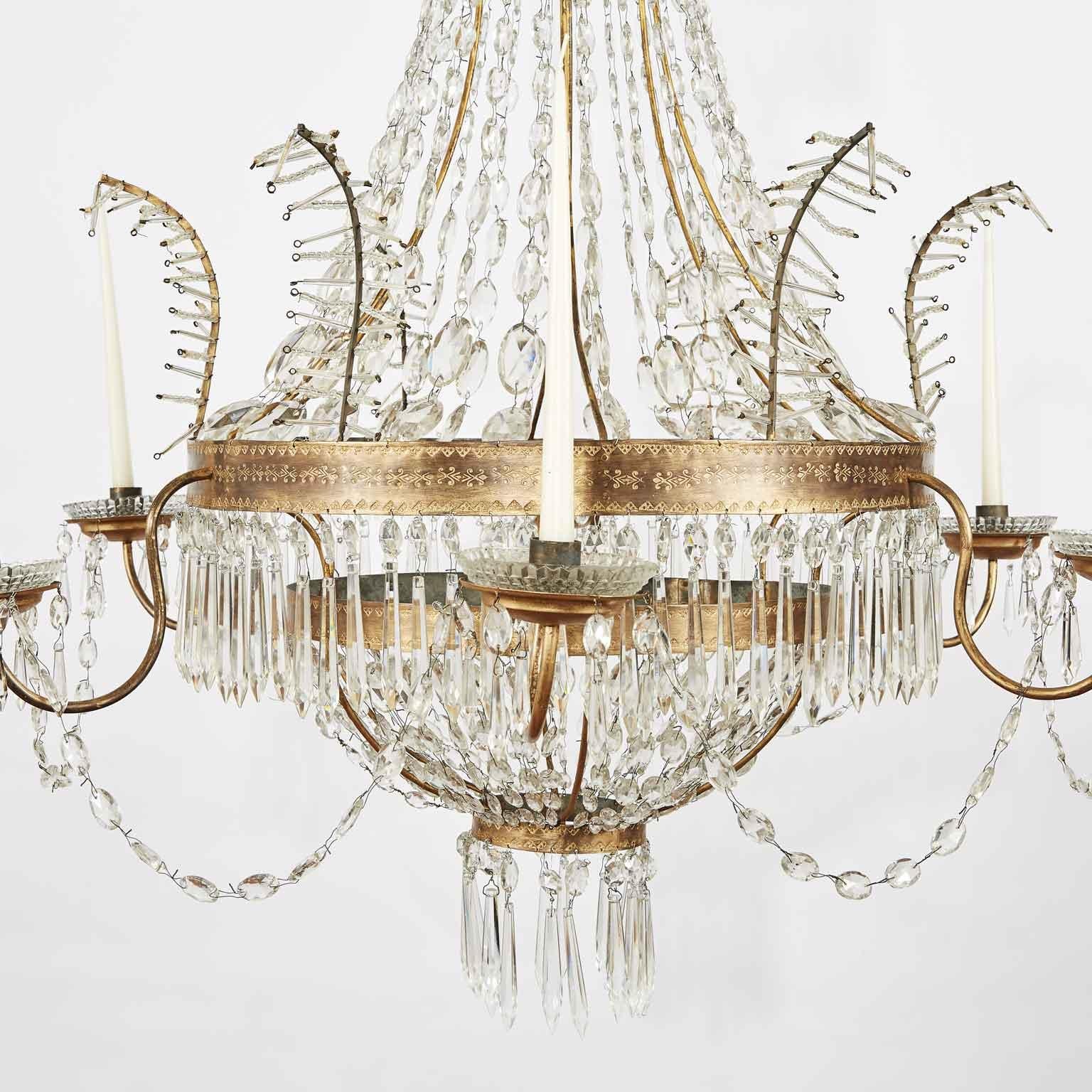 Antique original Empire six-light beaded crystal chandelier, dating back to late 18th century, of Italian origin, coming from a Piedmontese private palazzo. The hand-made circular structure consists of an Empire classical drop-shaped frame topped by