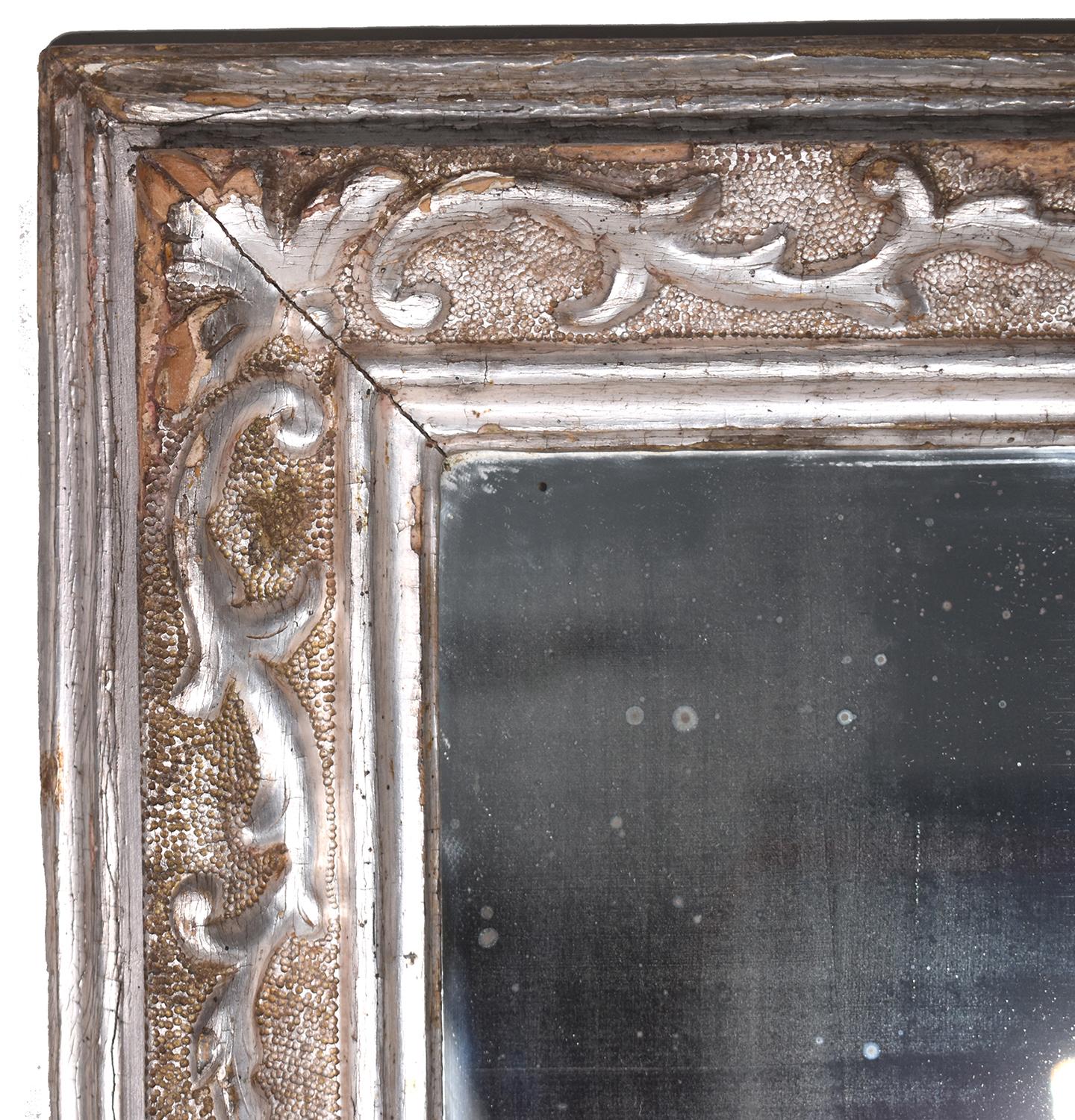 Silver Leaf 19th Century Empire Mirror Acanthus leaf and neoclassical medallion carved details.
Minor Loses and Fading.