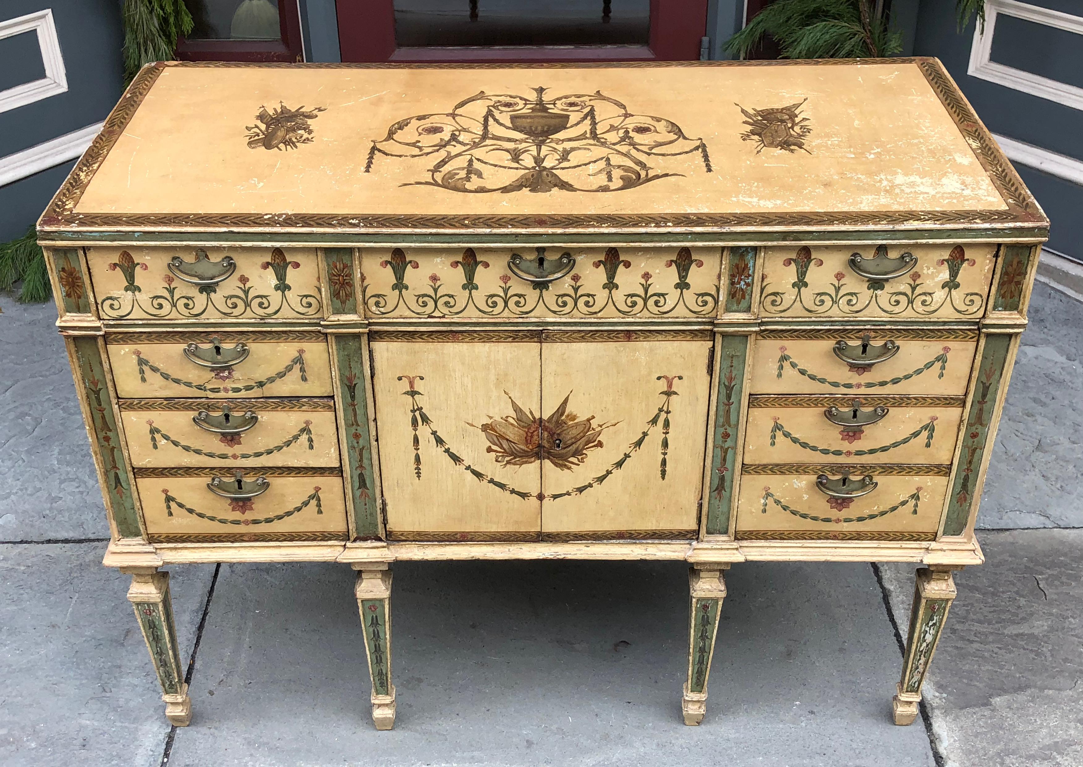 Beautiful 18th century English Adams painted commode. Single top drawer over the 2-door cupboard with 3 drawers on either side of the cupboard. The 18th century nickel pulls were added at a later date. Wonderful colors of the Adams period, minor