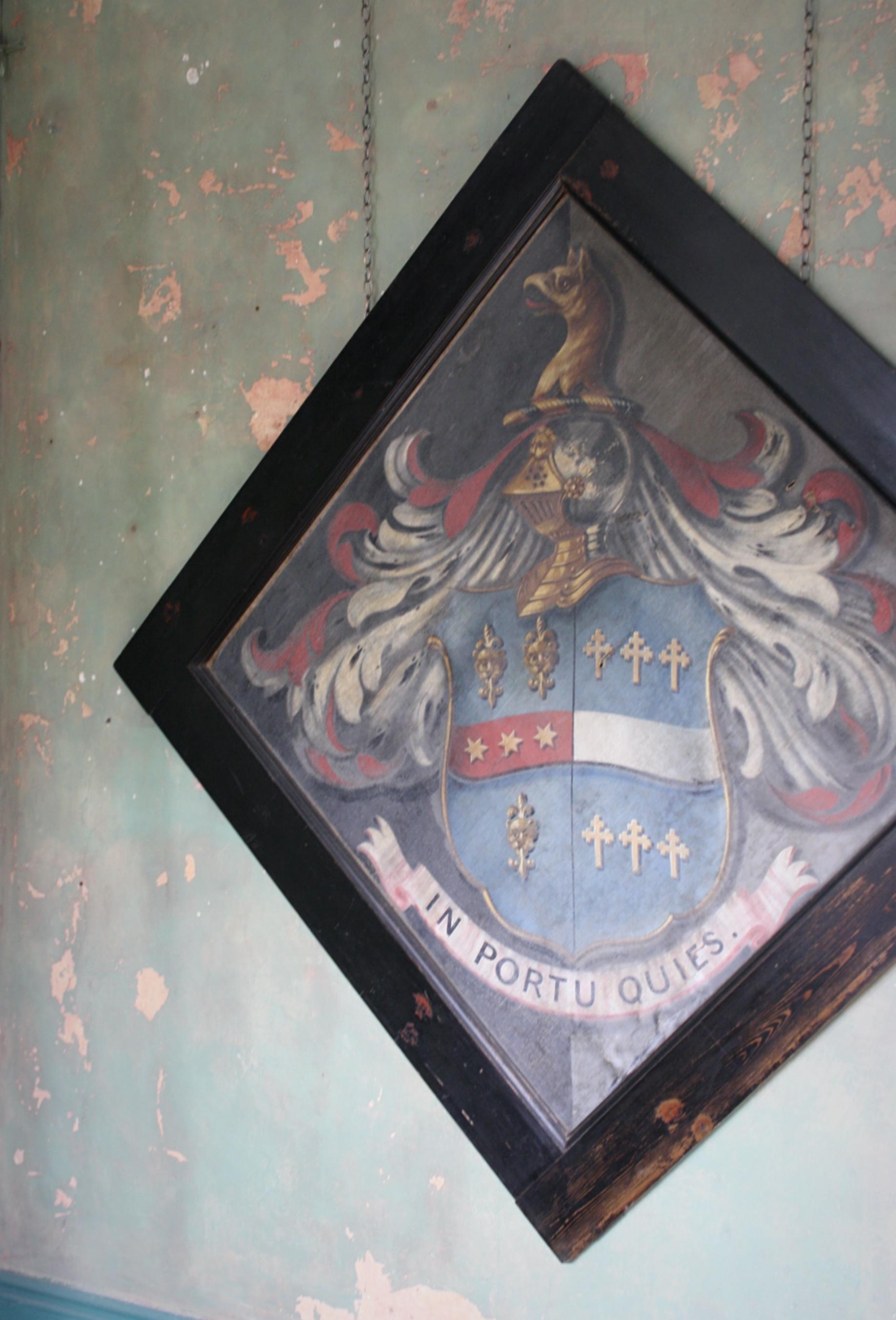 A highly decorative 18th century Hatchment of extra large proportions, the lozenged oil on canvas depicts a crest with the latin motto 