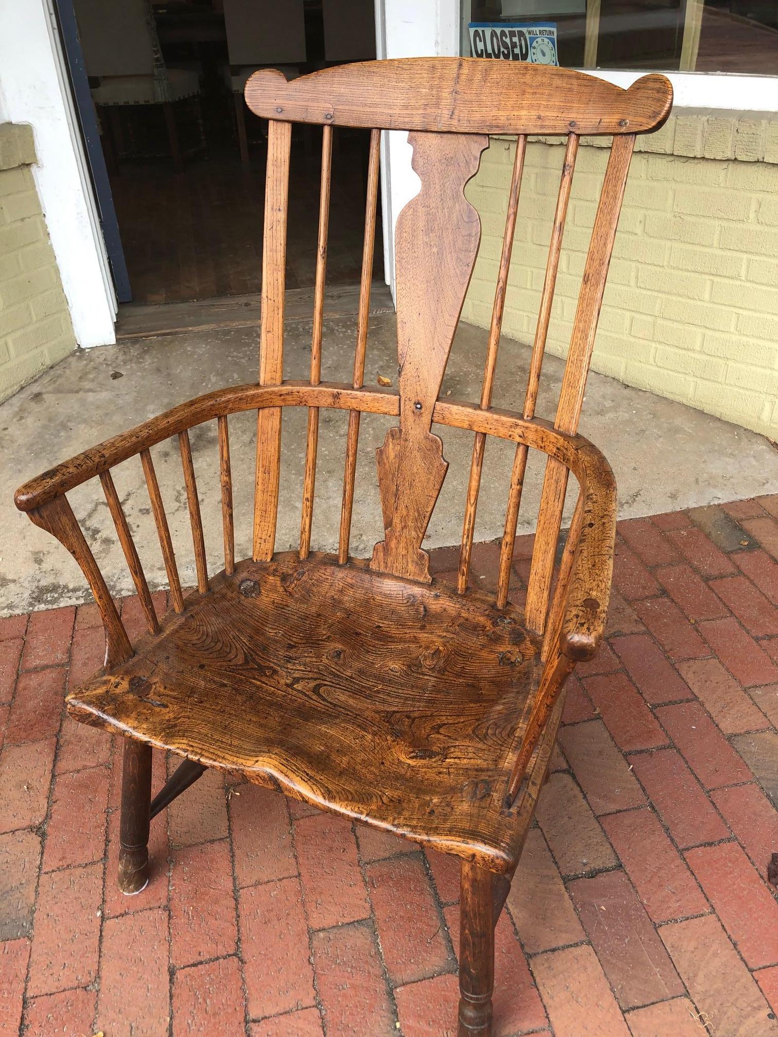 This 18th century English “Comb-Back” Windsor armchair made of ash, elm and walnut is not only beautiful is very comfortable too. Deep, lustrous color with warm patination and delicate spindles with central shaped splat. Elegant curved arms over a