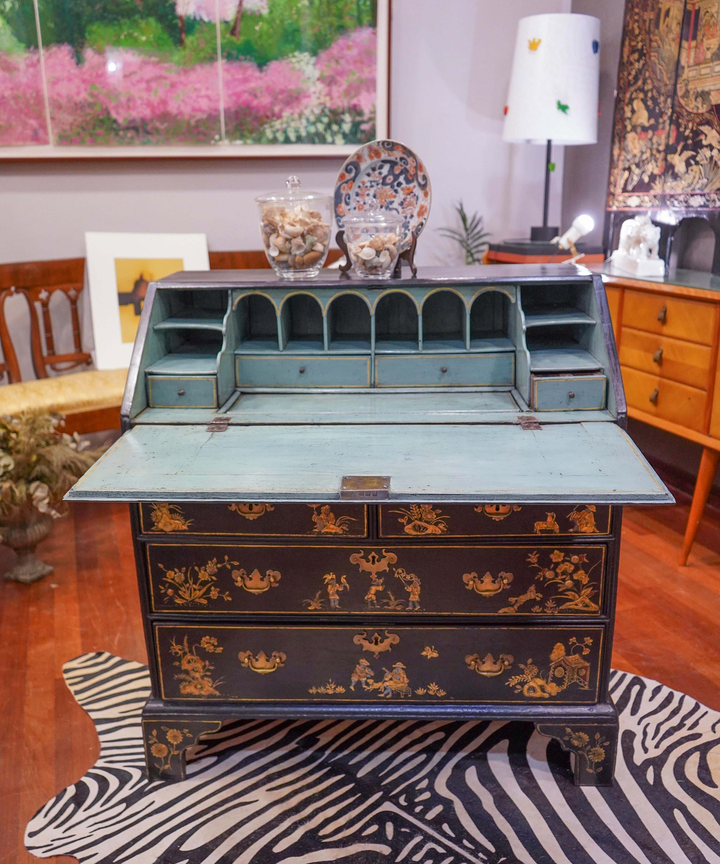 One of a kind Chinese exports black lacquered chinoiserie and golded painted with flowers, animals and scenes Bureau- chest.
18th century, English furniture .It has 3 drawers and a door that slams for desk, the interior with small drawers and