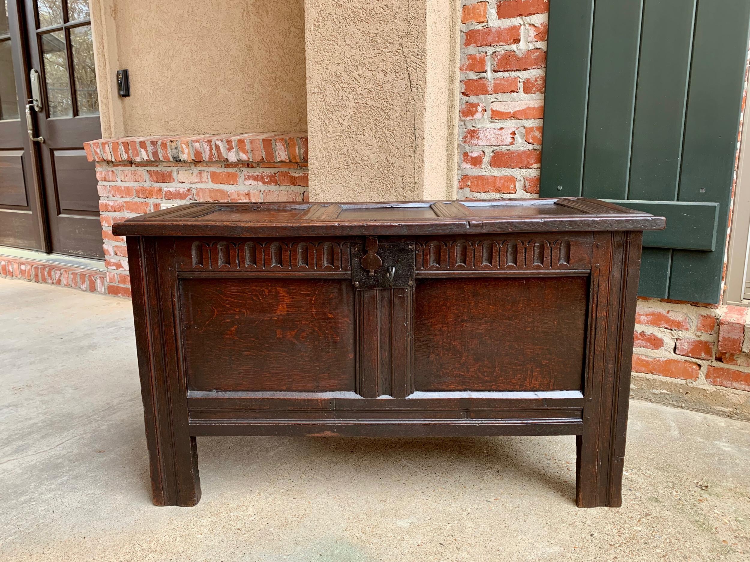 18th century English carved oak coffer trunk chest coffee table blanket box

~Direct from England~
~Lovely 18th century English coffee or chest, with traditional English style~
~Completely paneled lid and front~
~Hand carved ‘priory arches’ on the