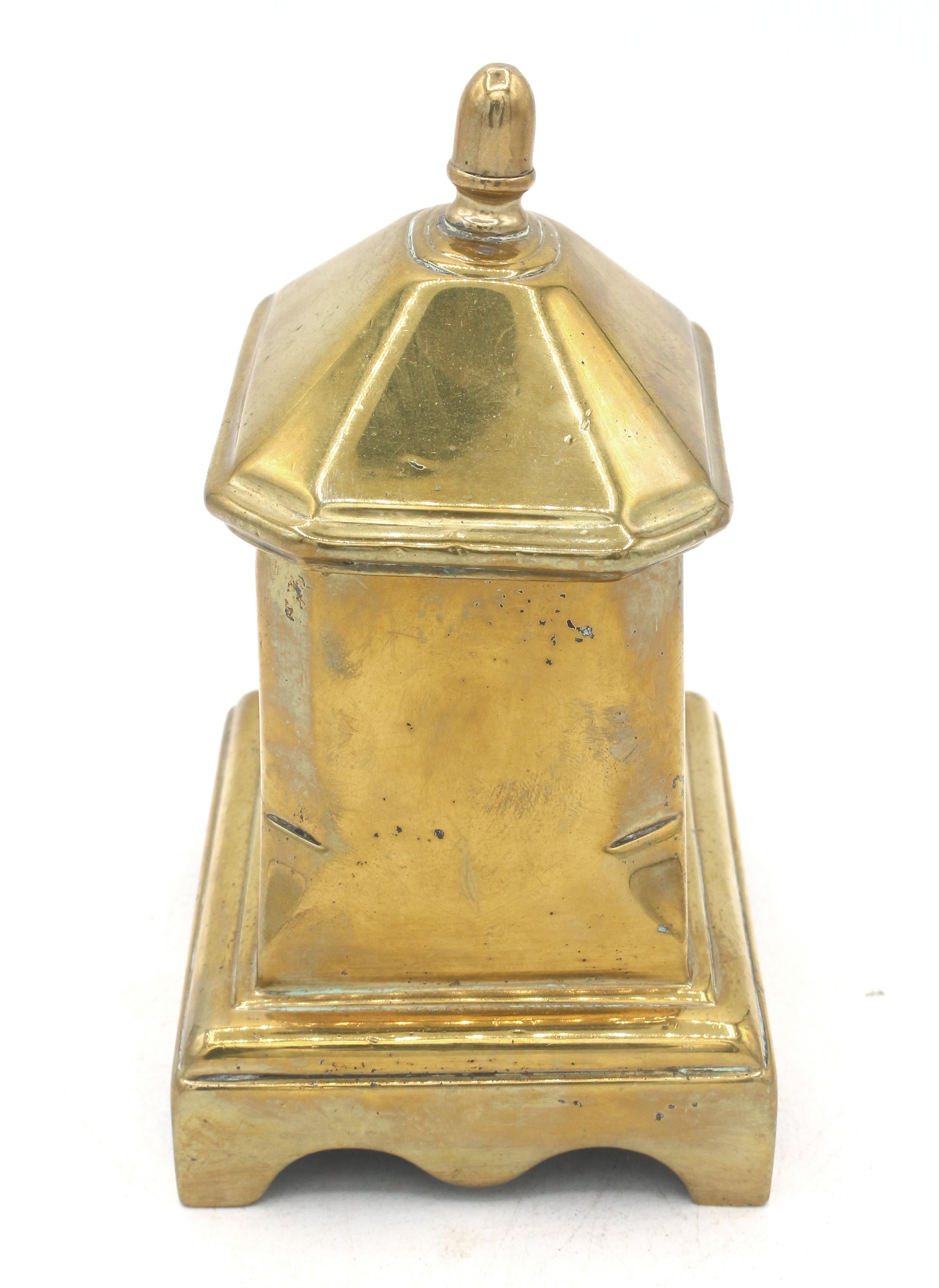 18th century cast brass English tobacco box. 8-sided form with conforming cover. Finial reset & body slightly askew so lid fits with a tilt.
4 1/8