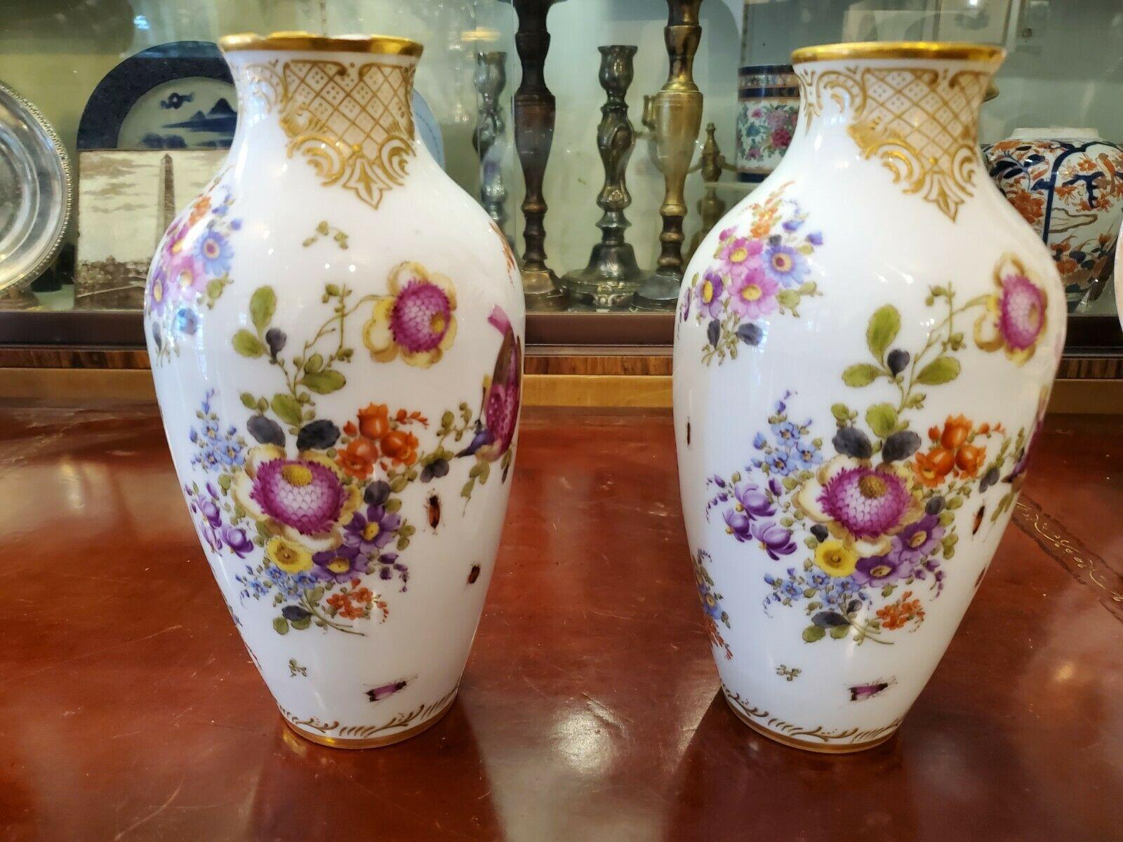 Pair of English Chelsea porcelain vases from the 18th century.

This pair of vases are 9 inches tall and bear the Gold Anchor mark. 

Beautifully decorated with a floral design and in generally good condition despite their age.