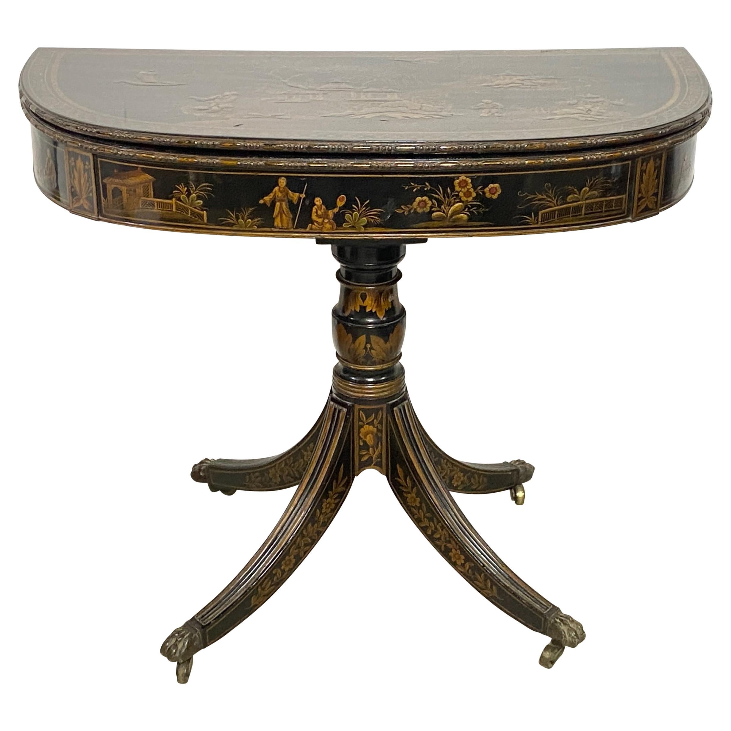Late 18th Century George II Period Games Table / Demi-Lune Console Table.
Lacquer with hand painted detailed chinoiserie raised gesso village scene with figures fishing, the piece folds out to reveal the scarlet playing surface.
In remarkable