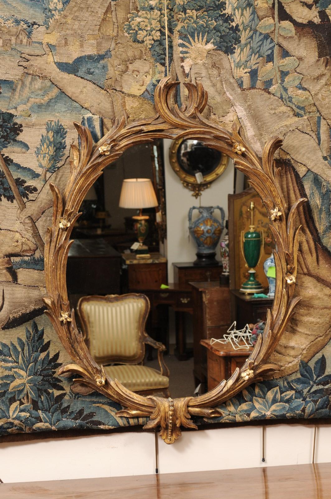 18th Century English Chippendale Oval Giltwood Mirror with foliage design In Good Condition In Atlanta, GA