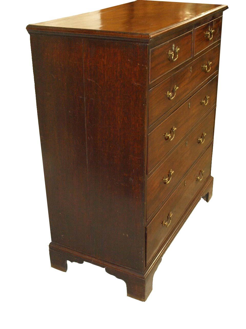 This 18th century English tall chest has a beautifully faded top of figured mahogany. There is a very small and minor split repair in the back right hand corner (see photo) . The two over four drawers retain their original swan neck brass pulls, the