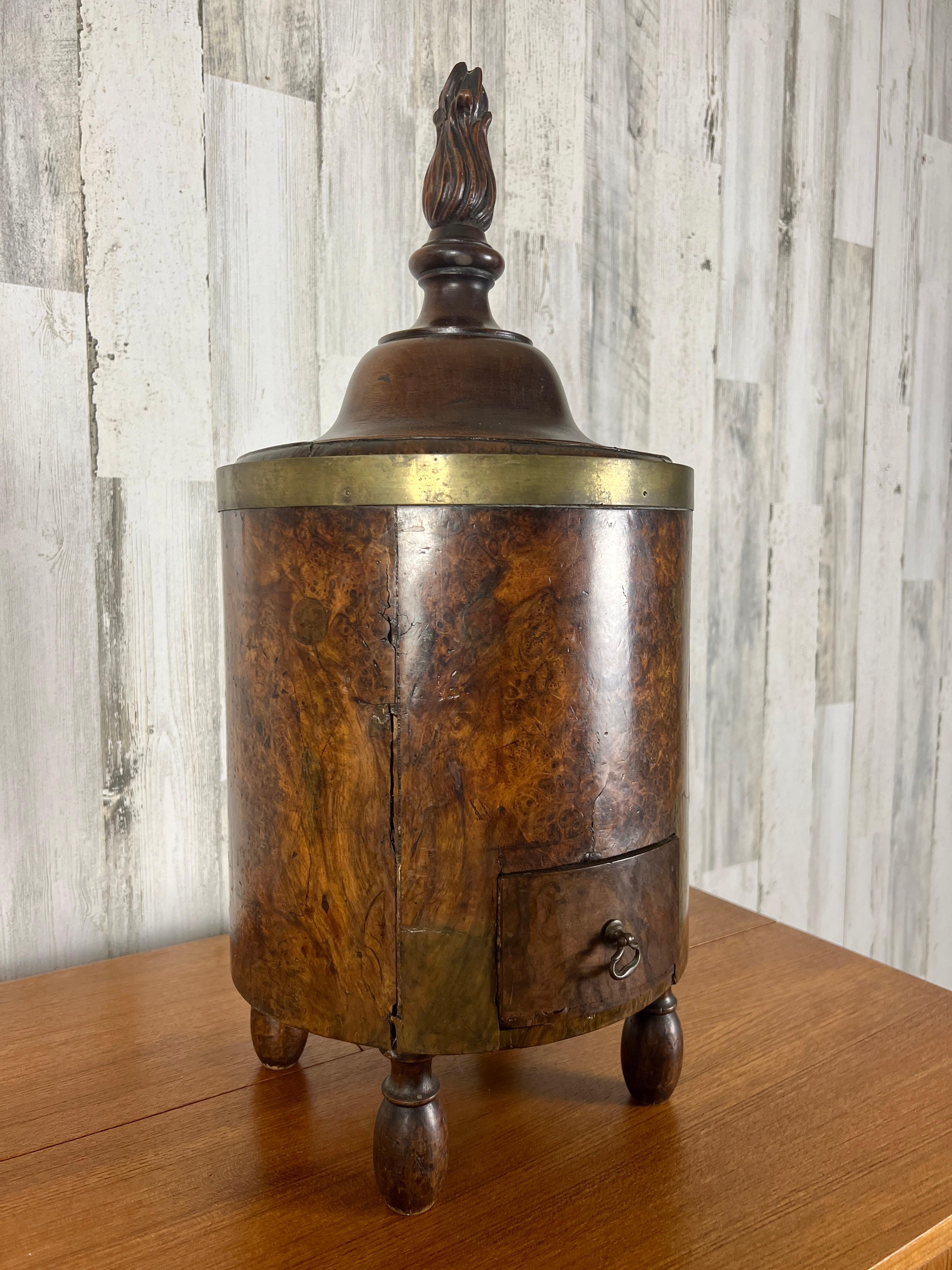 18th century Burlewood coal bucket with flame finial on top and match drawer at the bottom.