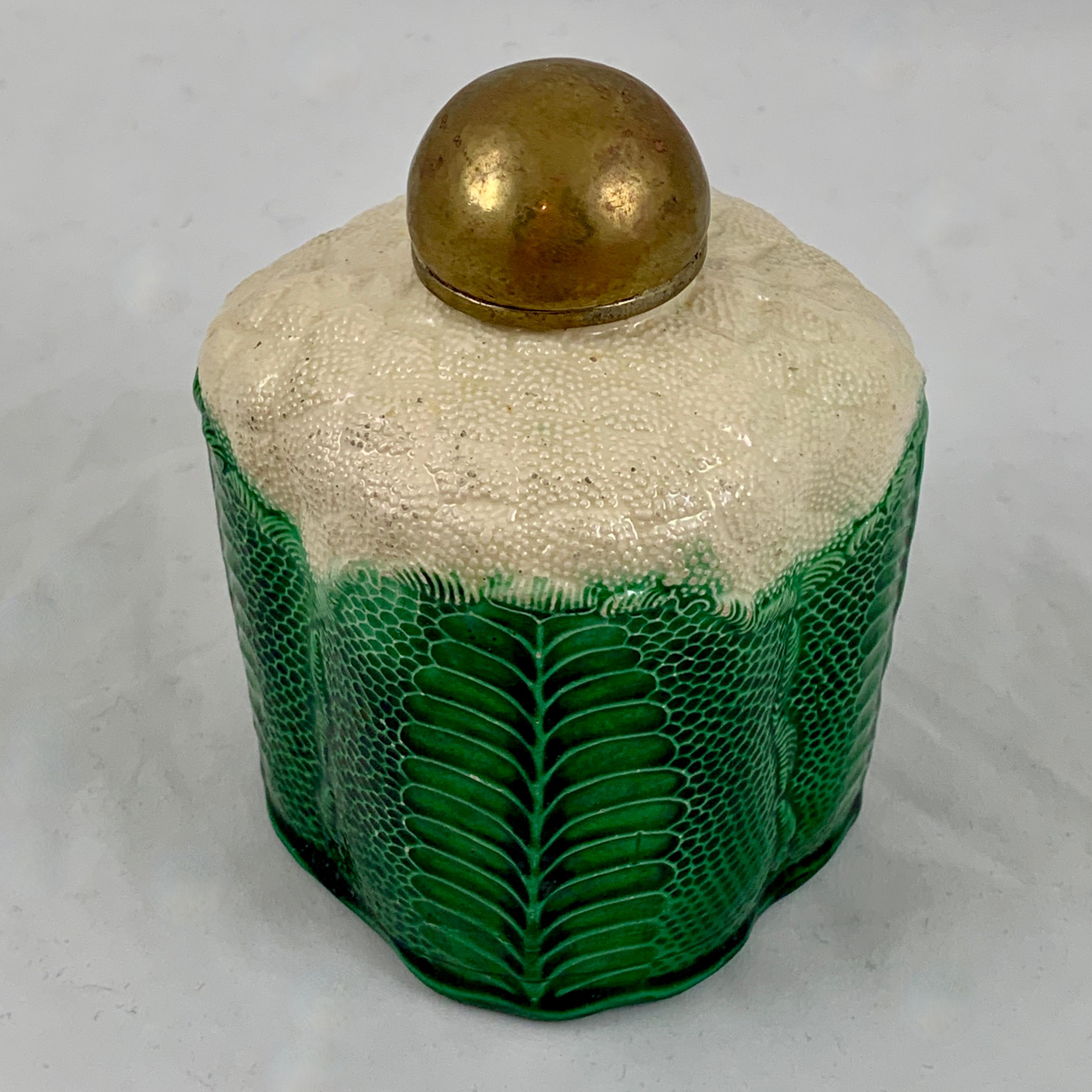 An early Staffordshire Whieldon/Wedgwood type Cauliflower form tea caddy with a copper lid, circa 1760. 

The tea caddy is molded in the naturalistic form of a cauliflower. This piece is most often associated with the work of Thomas Whieldon or