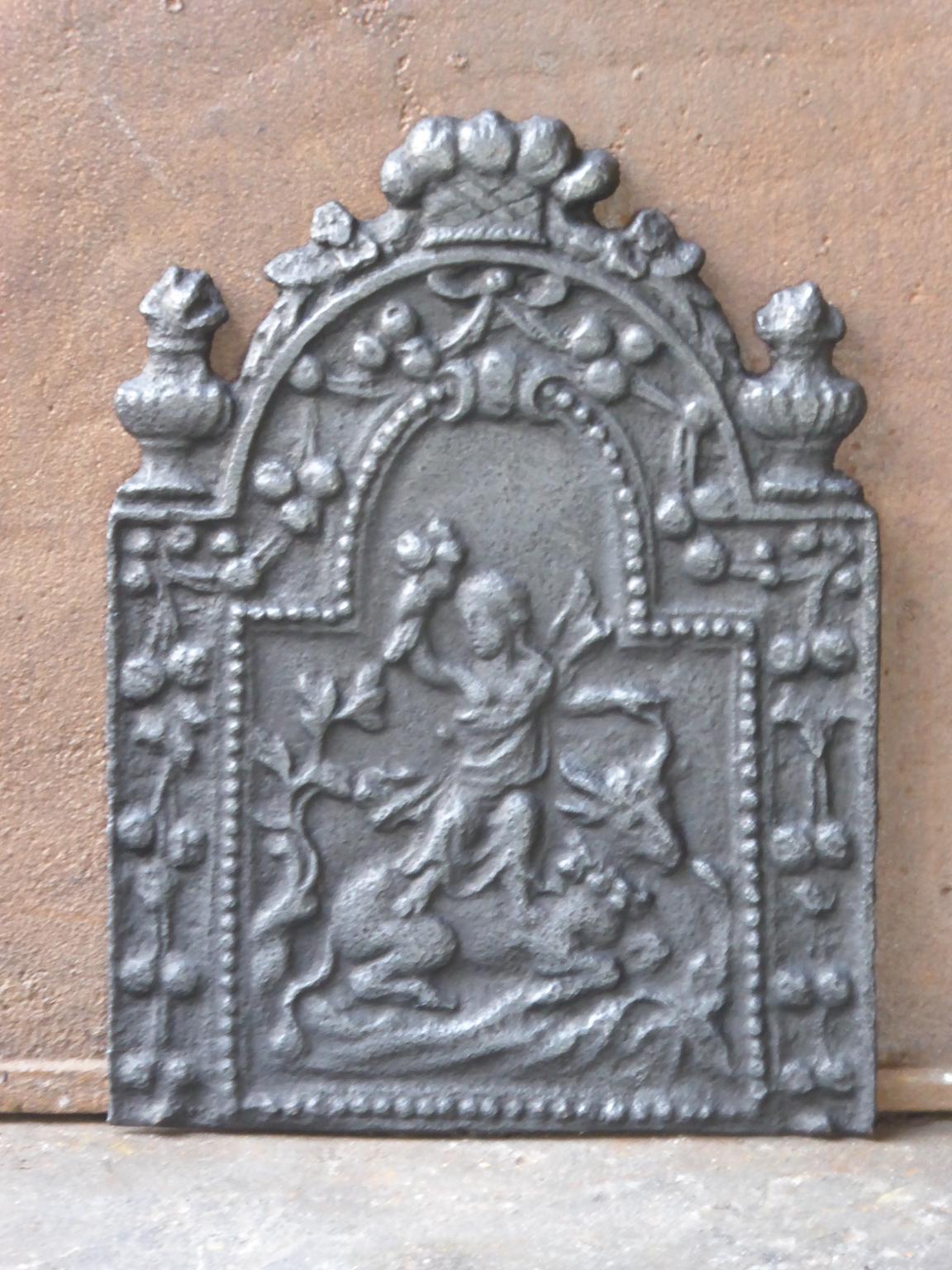 18th century English Georgian fireback with a cupid. The fireback is made of cast iron and has a black / pewter patina. It is in a good condition, without cracks.