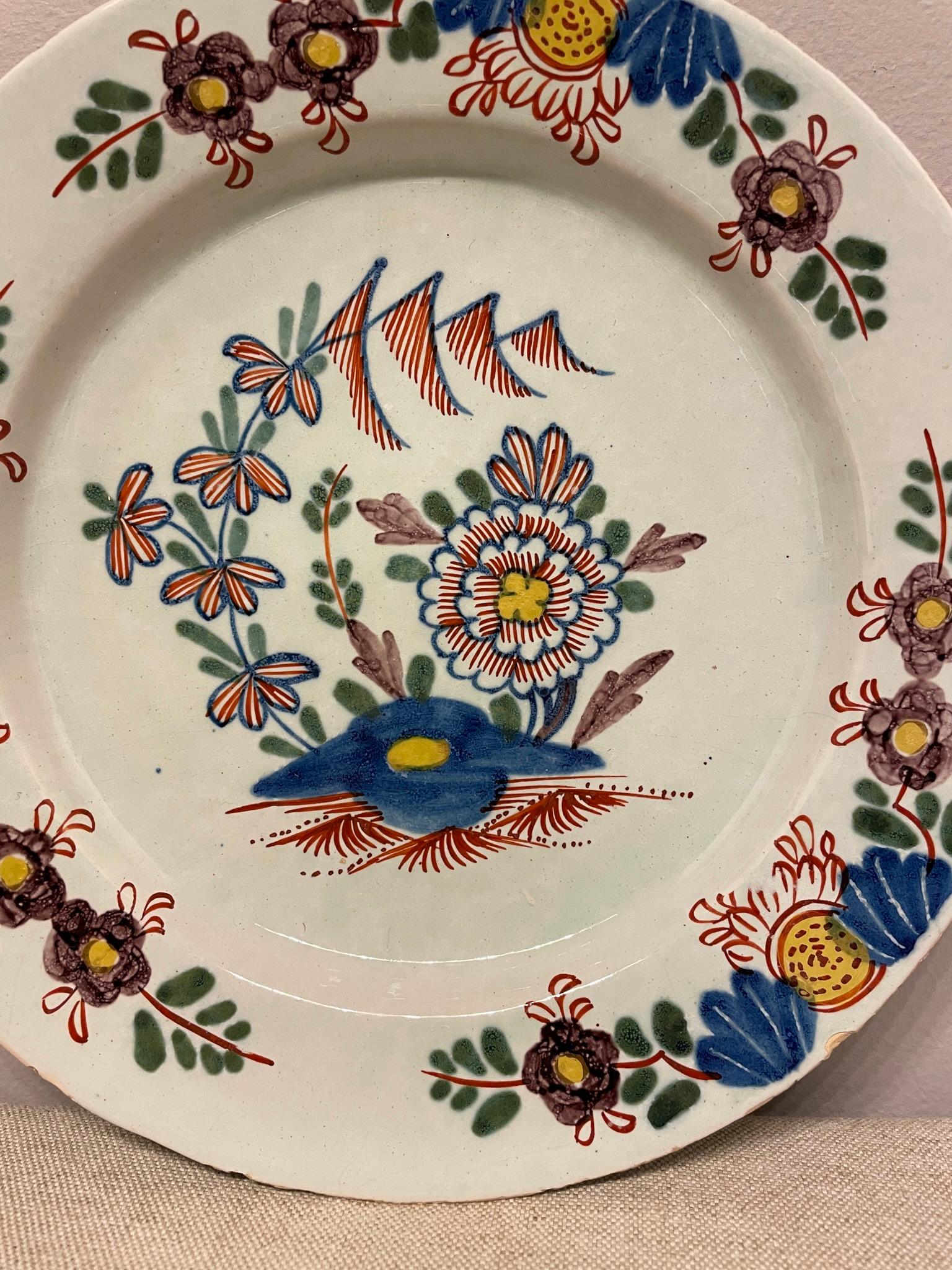 A good 18th Century English Delft Polychrome plate with great colors. Typical wear for this type of plates. Chips on the rim . No hairline no restoration noted, There are some edge flakes typical of Delft plates from this period of time.
Dimensions