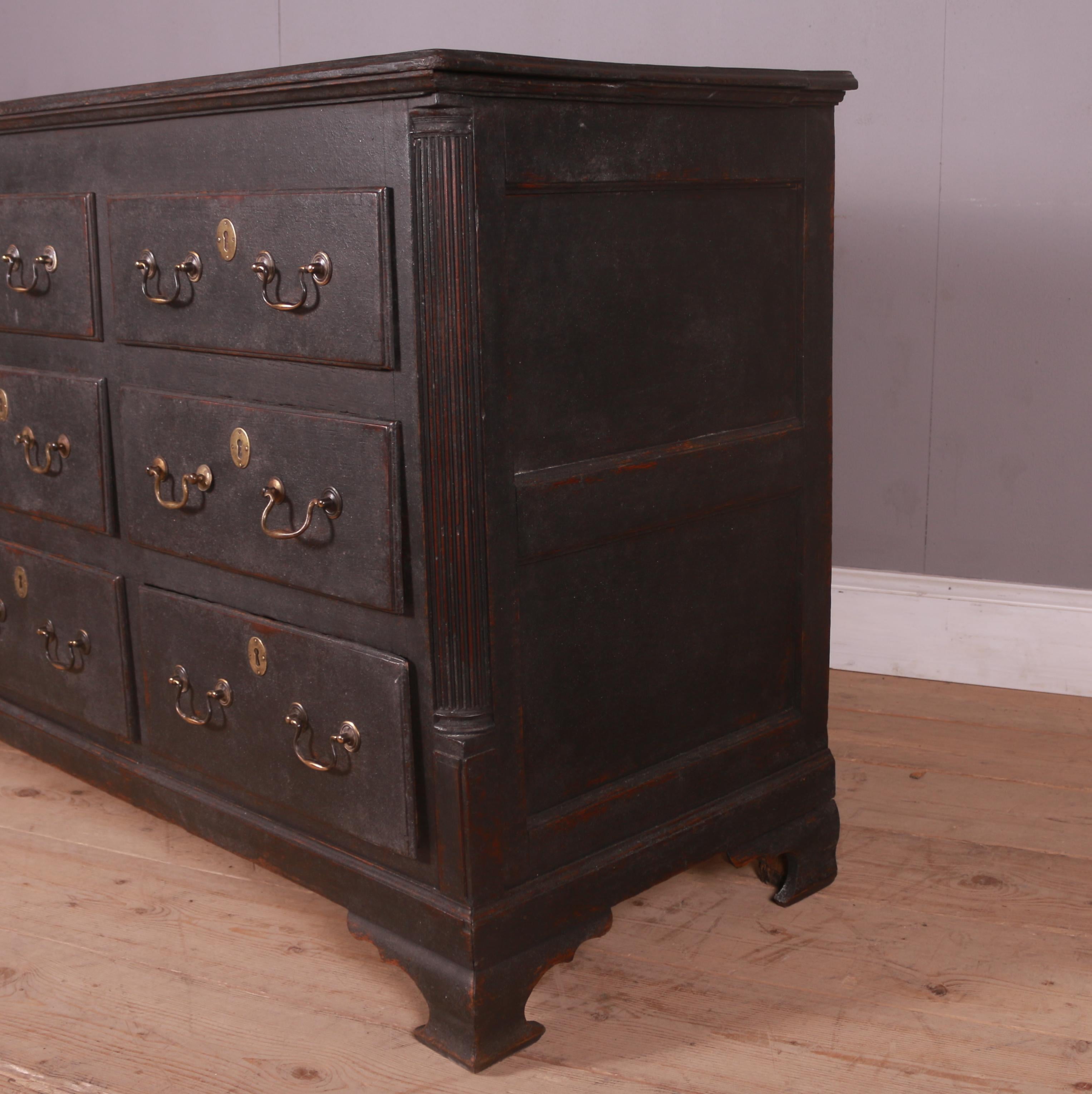 18th C English painted 9 drawer oak chest / dresser base. 1790.

Dimensions
63 inches (160 cms) wide
22 inches (56 cms) deep
35 inches (89 cms) high.

    