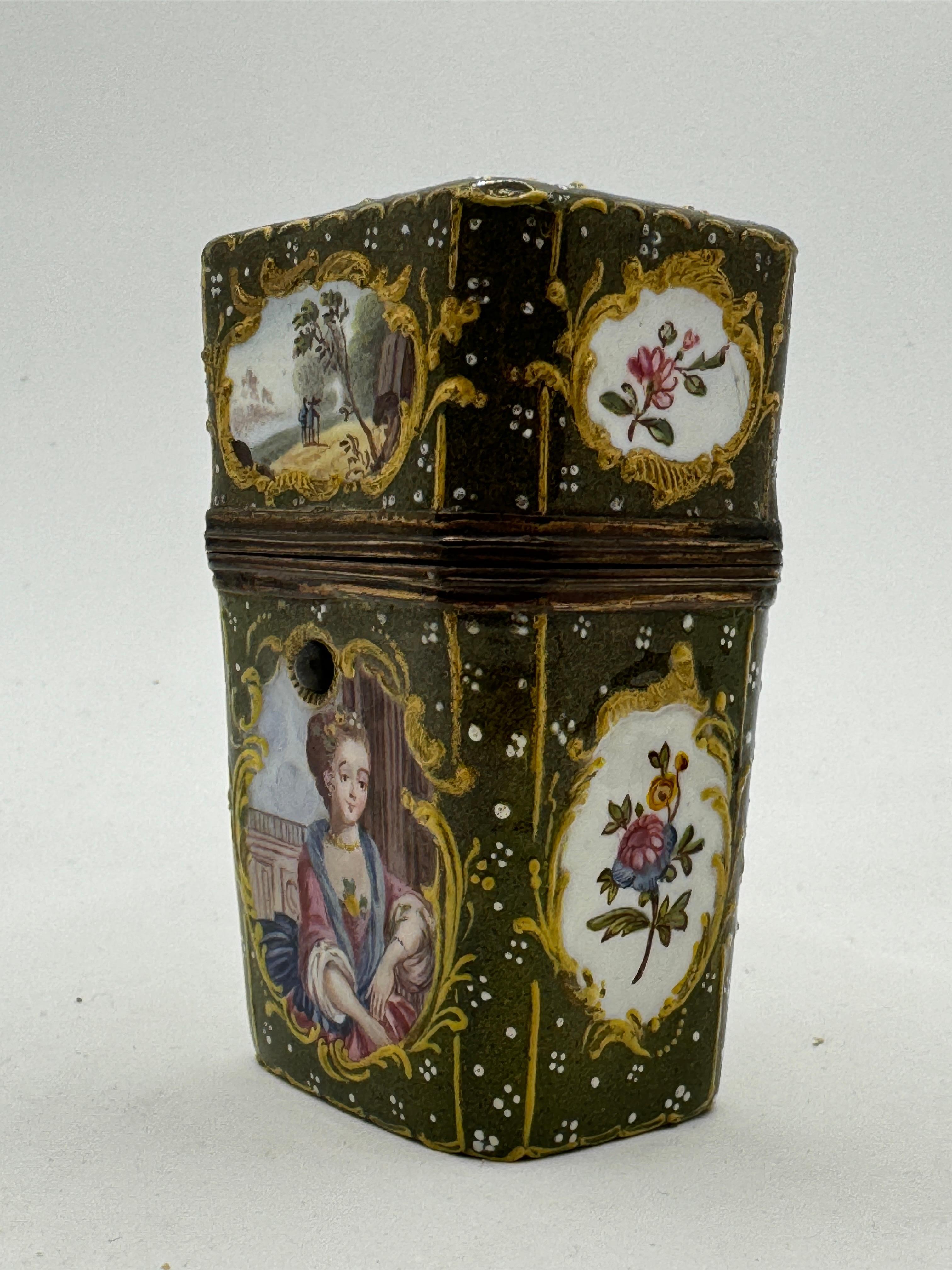 Unusual olive-green ground reserve Etui, circa 1780, of painted enamel on copper, with gilt copper mount, containing two cut glass scent-bottles and stoppers, an ivory memorandum tablet, and 5 metal implements. Upright, octagonal, tapering slightly