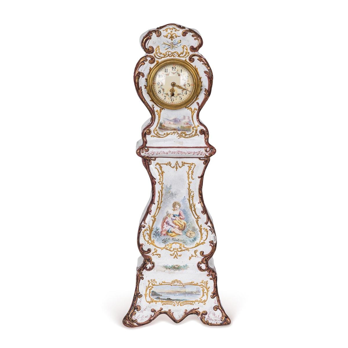 Antique 18th Century English enamel table clock, exuding charm, its delicate white enamel adorned with floral motifs and romantic scenes. Made in a miniature form of a grandfather clock, of curved upright form, embellished with foliage painted along