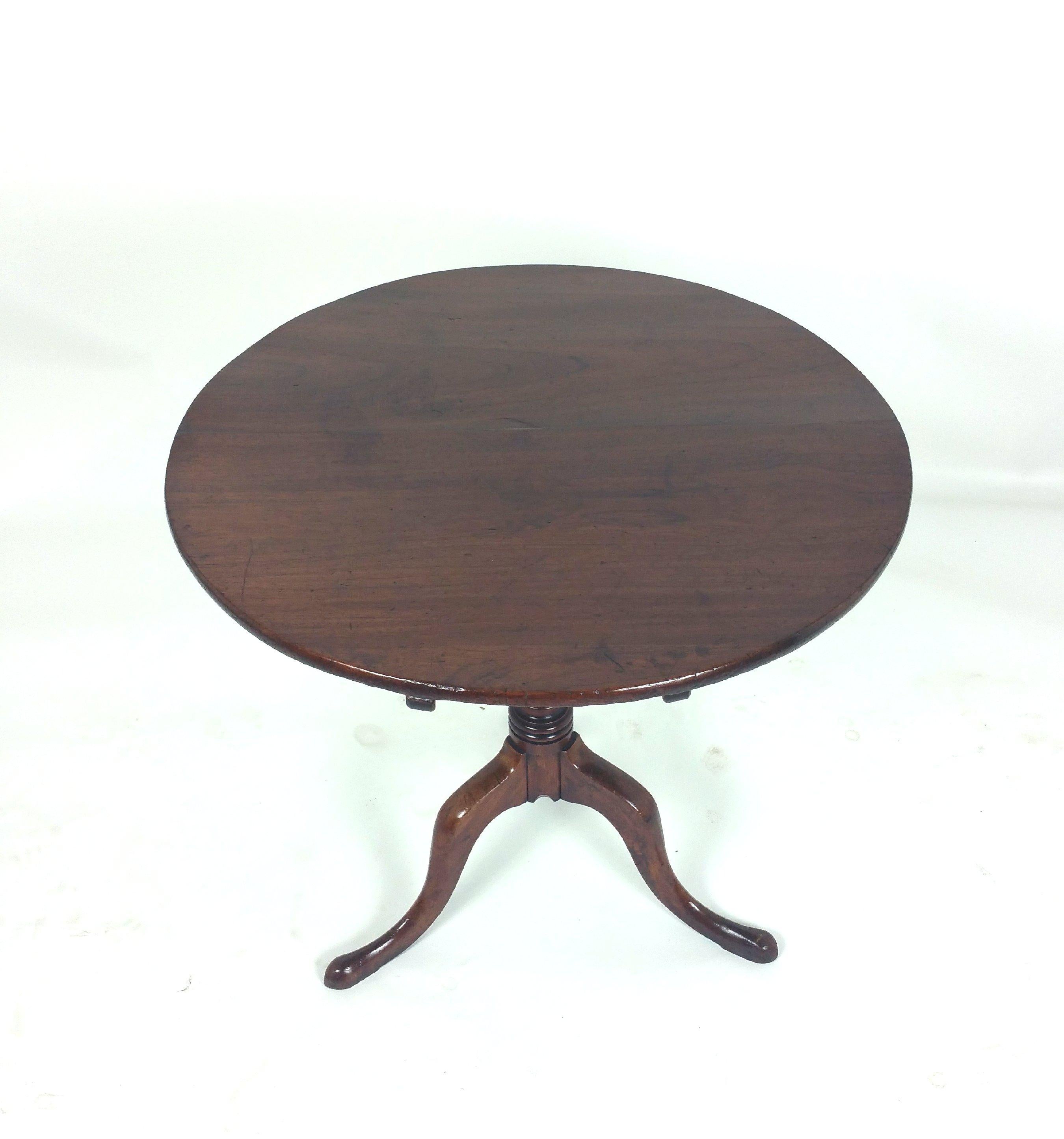 This wonderful 18th century English fruitwood tilt top table features a solid planked top and is supported on a tripod base with pad feet. The table measures 32 in–81.2 cm in diameter and 28 in–71.1 cm in height. It’s simple yet classic design makes