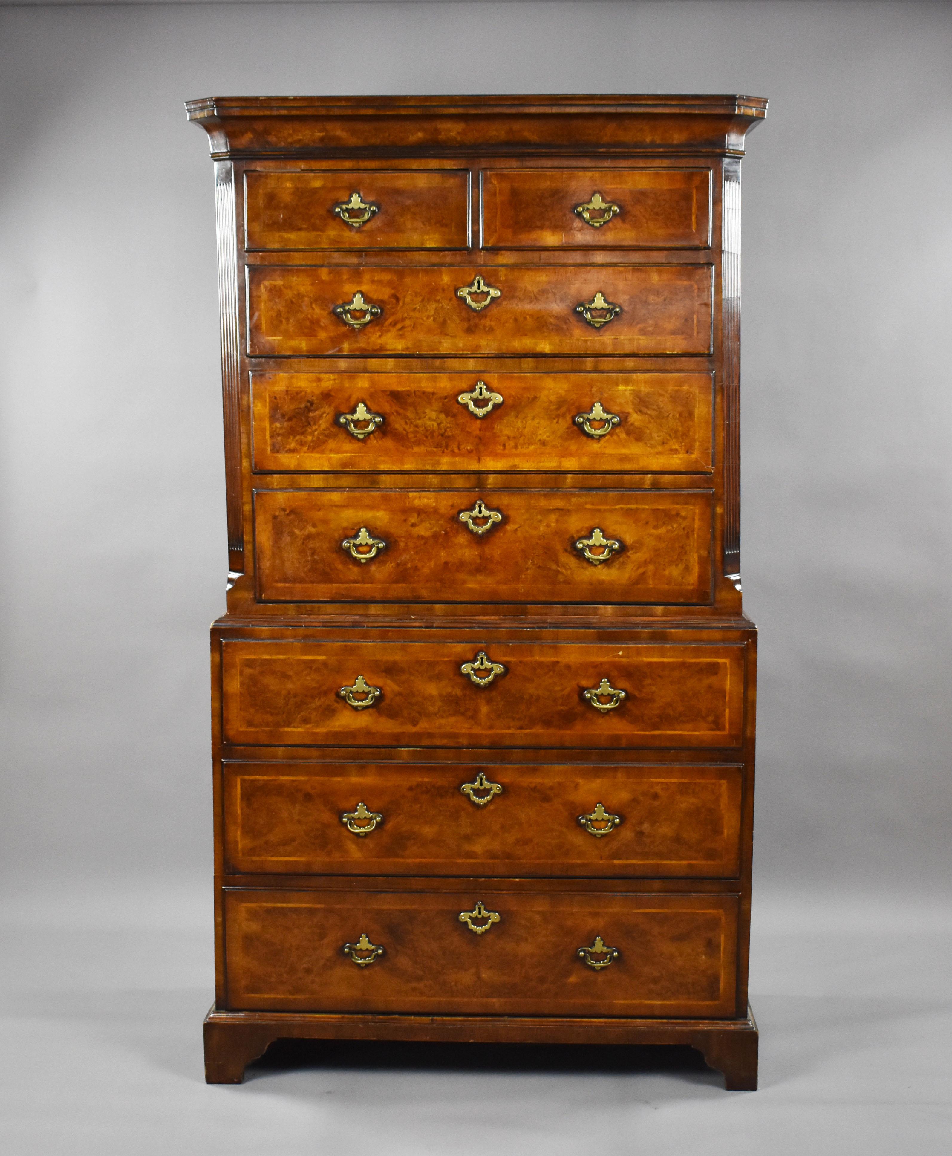 For sale is a good quality George II Burr walnut chest on chest, having a flared cornice above an arrange of five drawers in the top, each with herringbone inlay and banded edges, flanked by canted corners. The bottom chest is complete with a