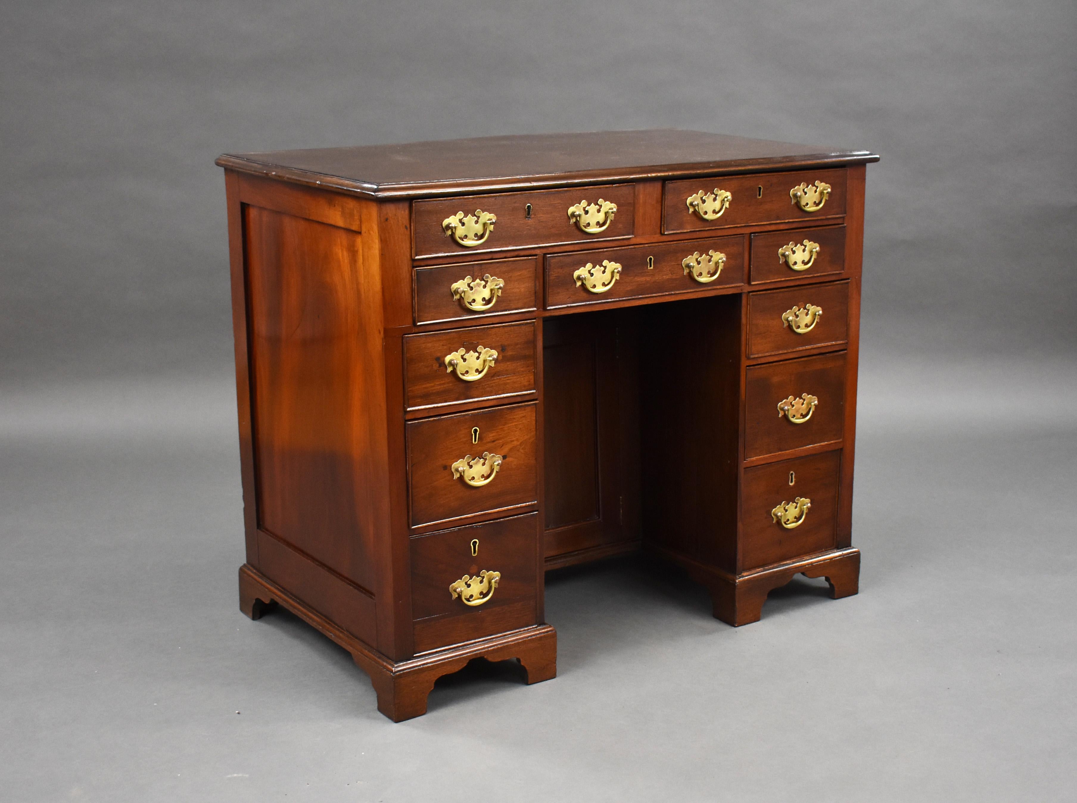 For sale is a George III mahogany kneehole desk, having a total of 11 drawers and a cupboard to the centre, the desk stands on small bracket feet and is in very good condition for its age. 

Measures: width: 93cm, depth: 53cm, height: 76cm.