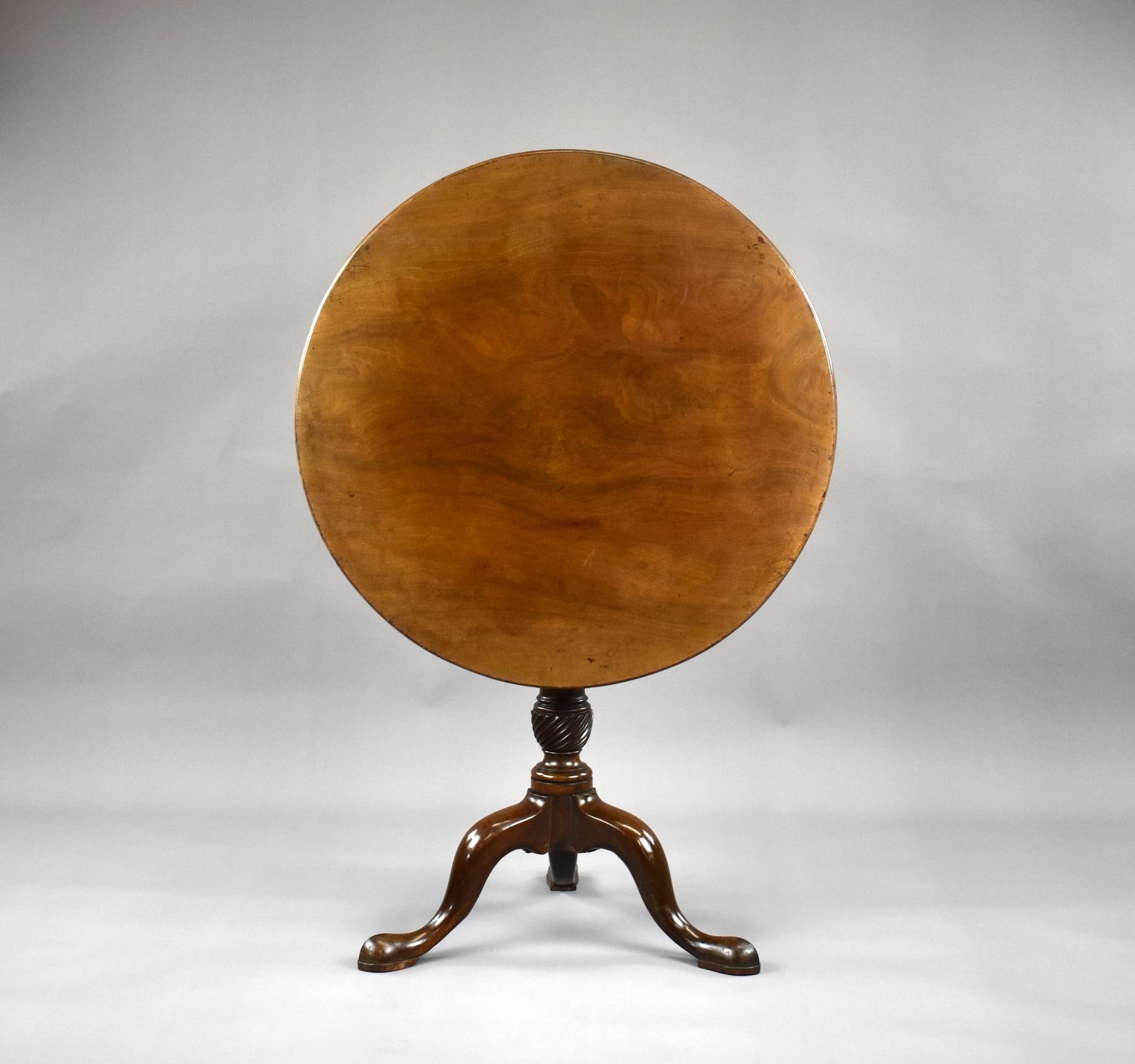 For sale is a very good quality George III Mahogany Tripod Table, having a single piece solid mahogany top, above a bird cage mechanism above a turned stem with a writhed carving to the base, above three elegant legs. The table remains in good