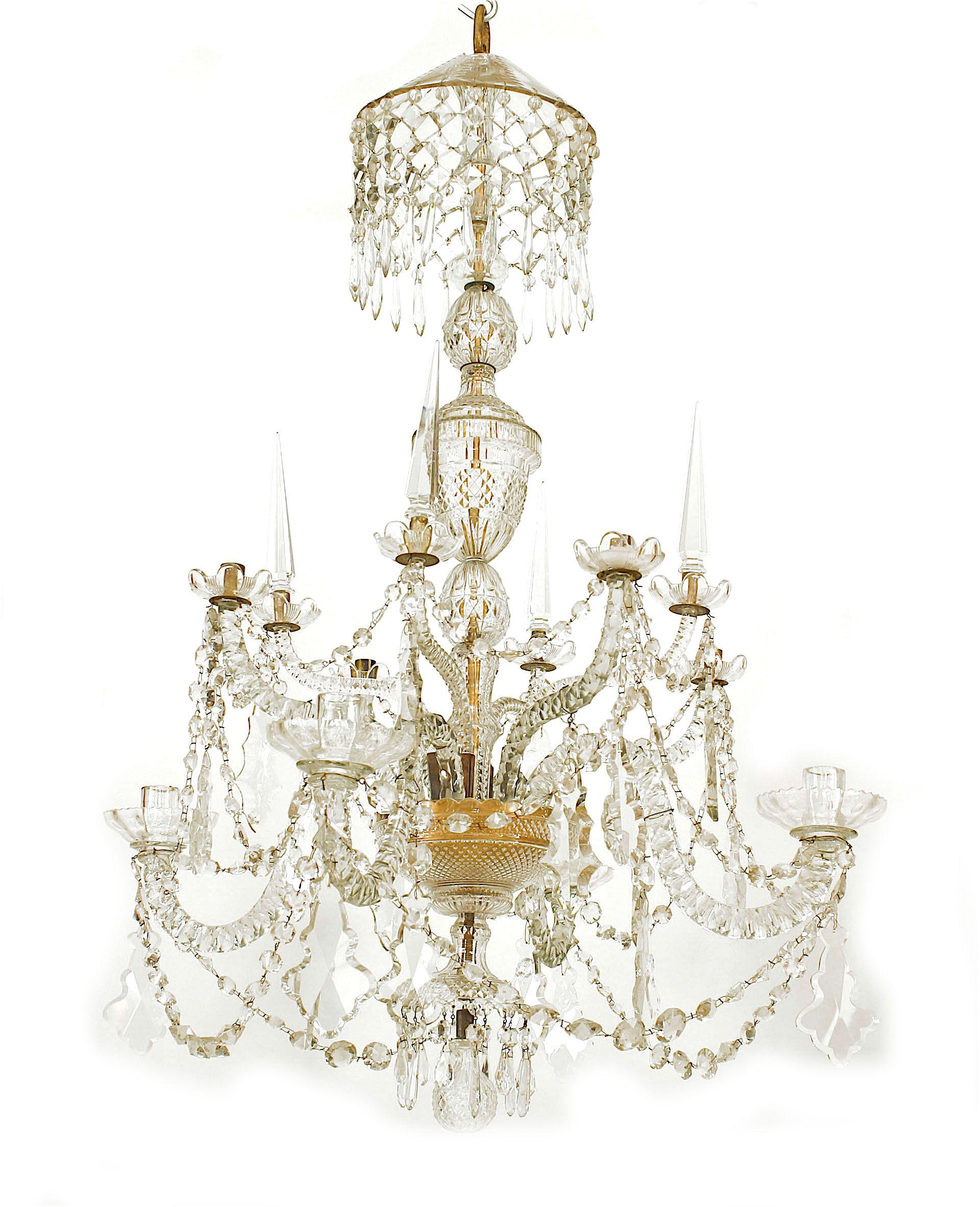 English Georgian 8 scroll arm cut crystal chandelier on 2 tiers with 4 arms with obelisks and 3 tiers of swags with a ball finial bottom (18th Century and latter additions).