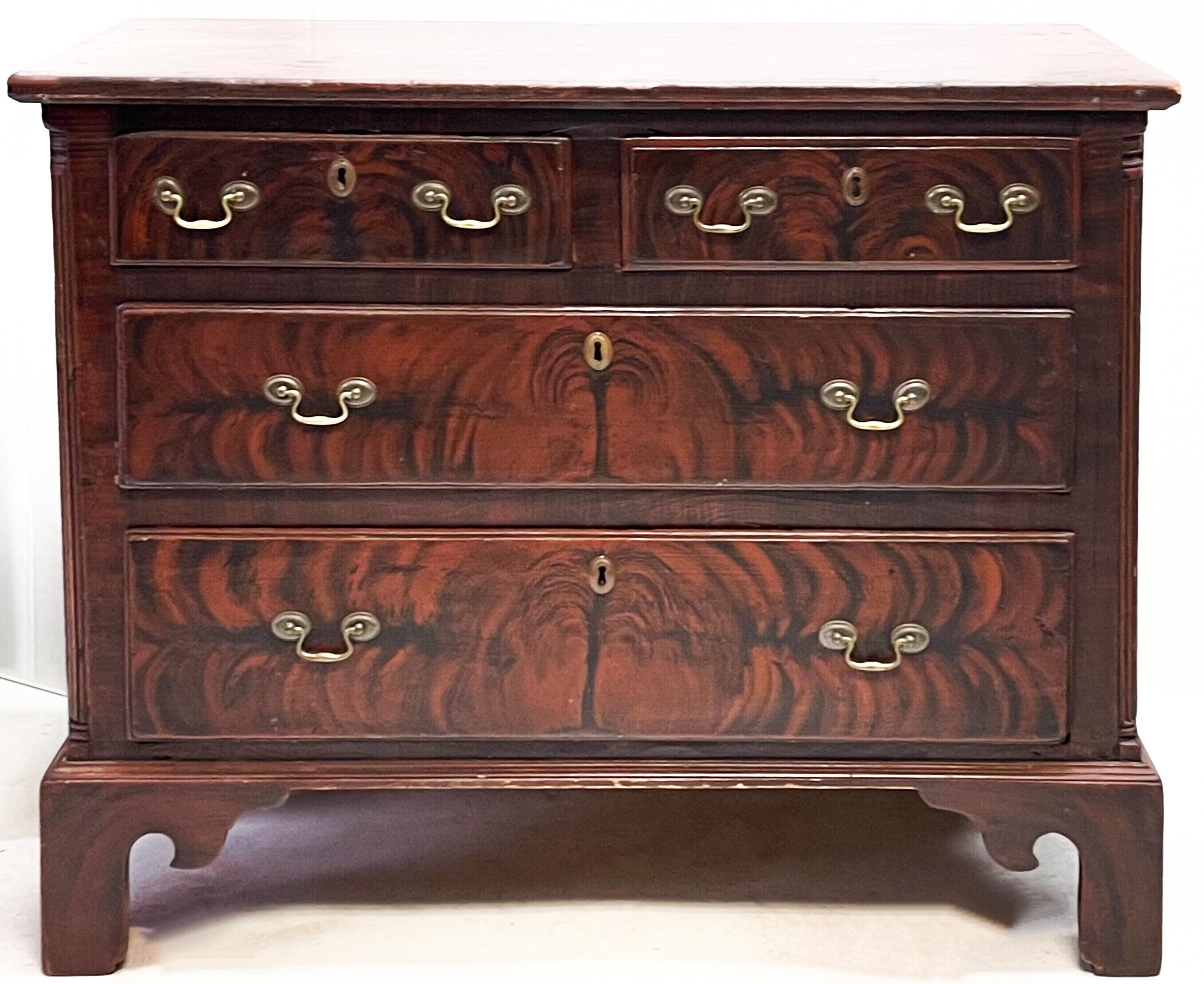 This is an amazing period piece! It is an English Georgian chest of drawers. The grain painting is magnificent. Note the sides and front! The piece appears to be in it’s original condition with peg construction and bracket feet. Versatile piece that