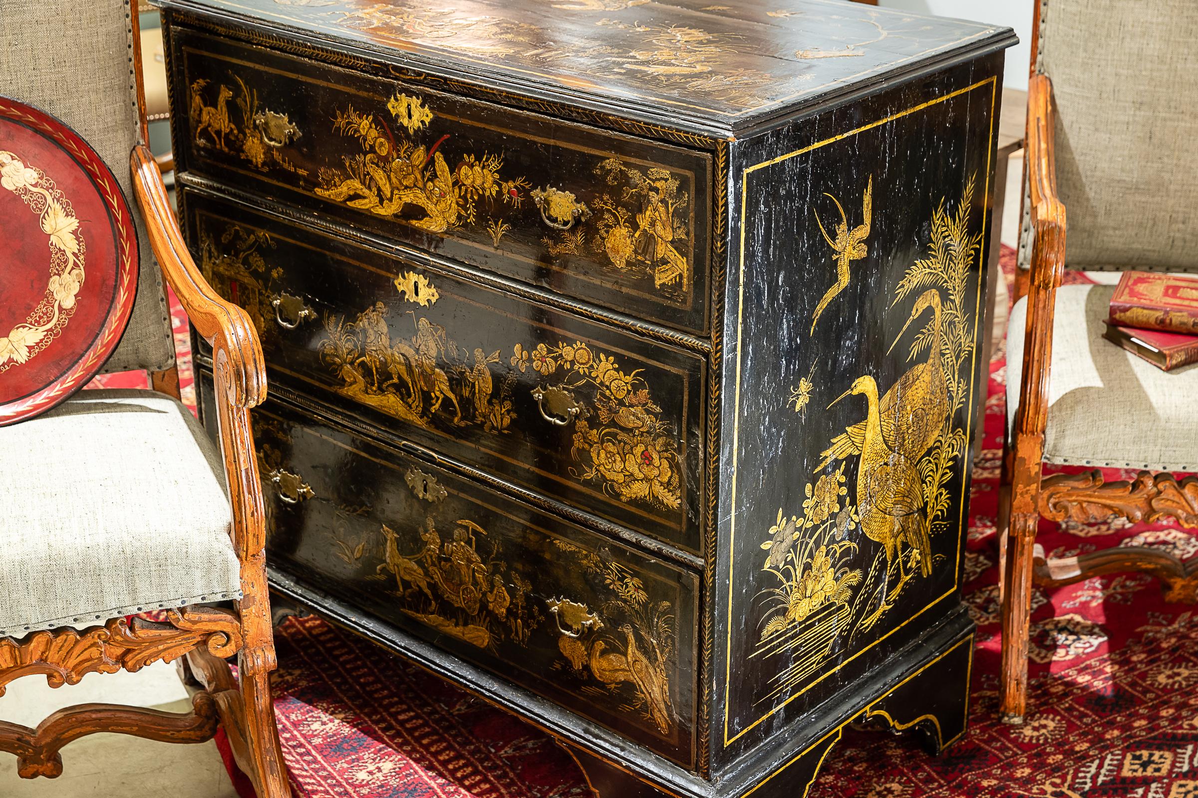 18th century English Japanned 3-drawer chest with raised lacquer decoration of fanciful and exotic scenes comprised of fanciful birds, animals, and persons. Old, if not original, hardware including drawer locks.
