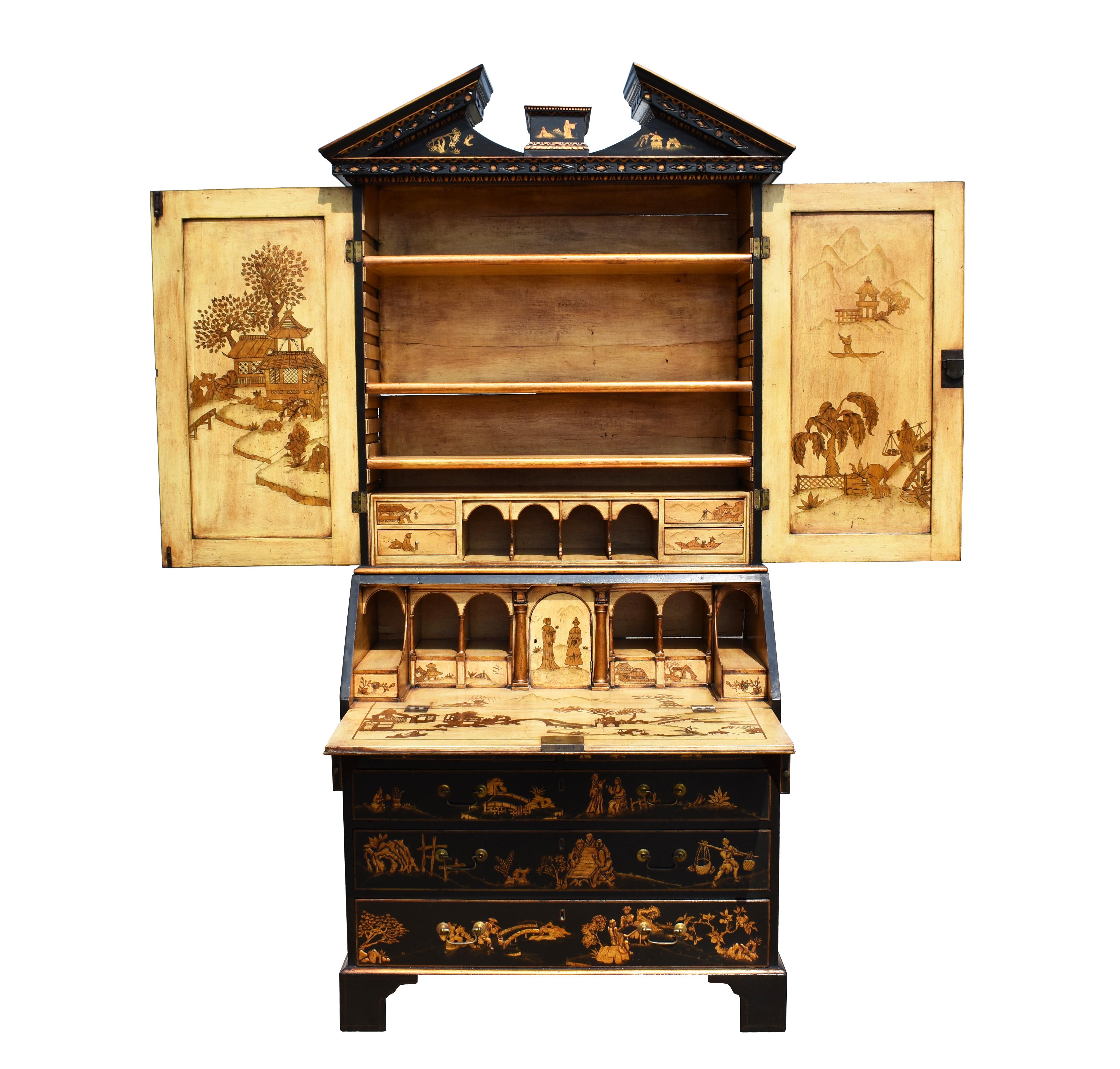 A good quality English 18th century George II lacquer and gilt chinoiserie secretary bookcase, having a broken arched pediment with hand carved mouldings above two paneled doors opening to reveal a fully decorated and partly fitted interior above