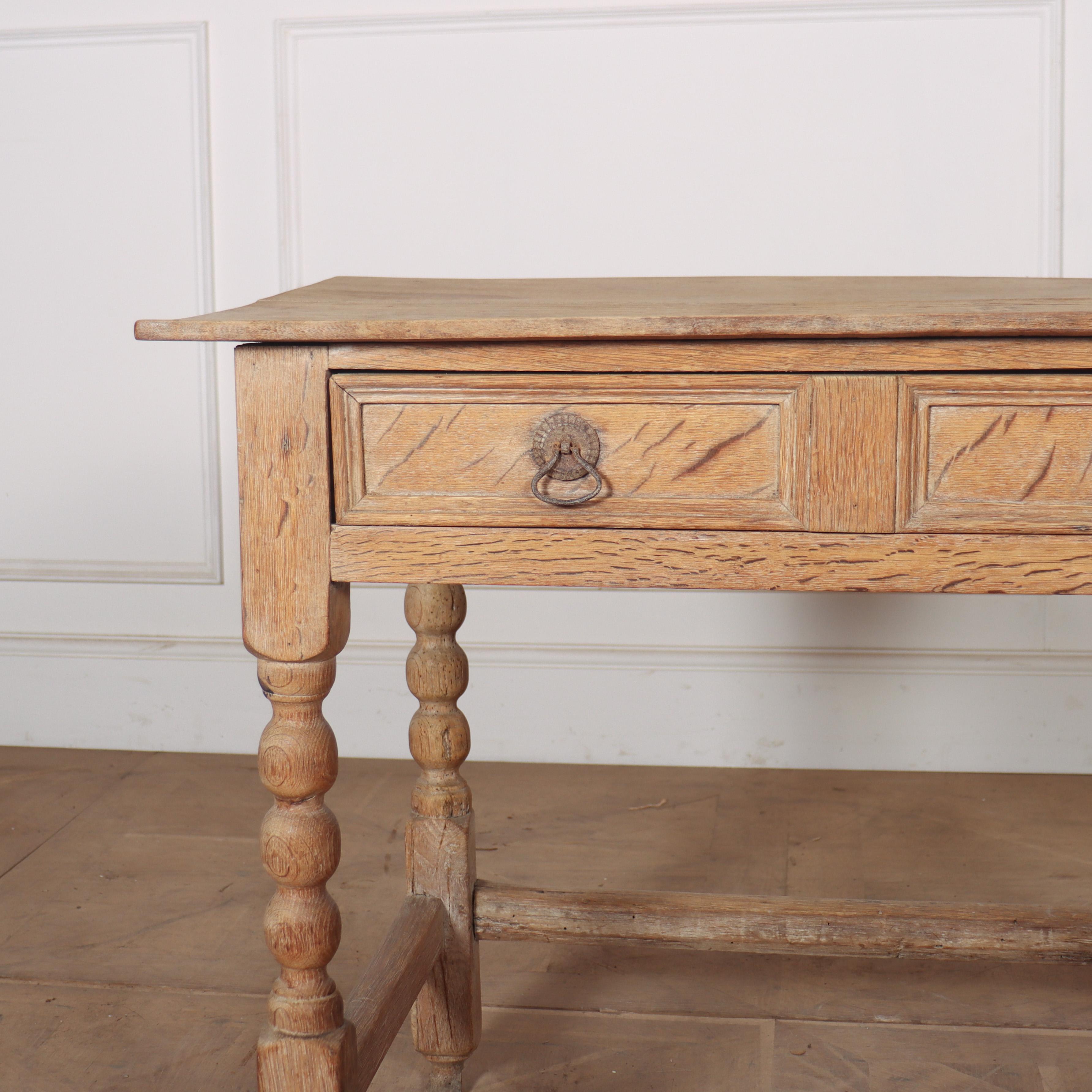 Early 18th C English bleached oak one drawer lamp table. 1730.

Reference: 8177

Dimensions
34 inches (86 cms) Wide
21.5 inches (55 cms) Deep
28 inches (71 cms) High