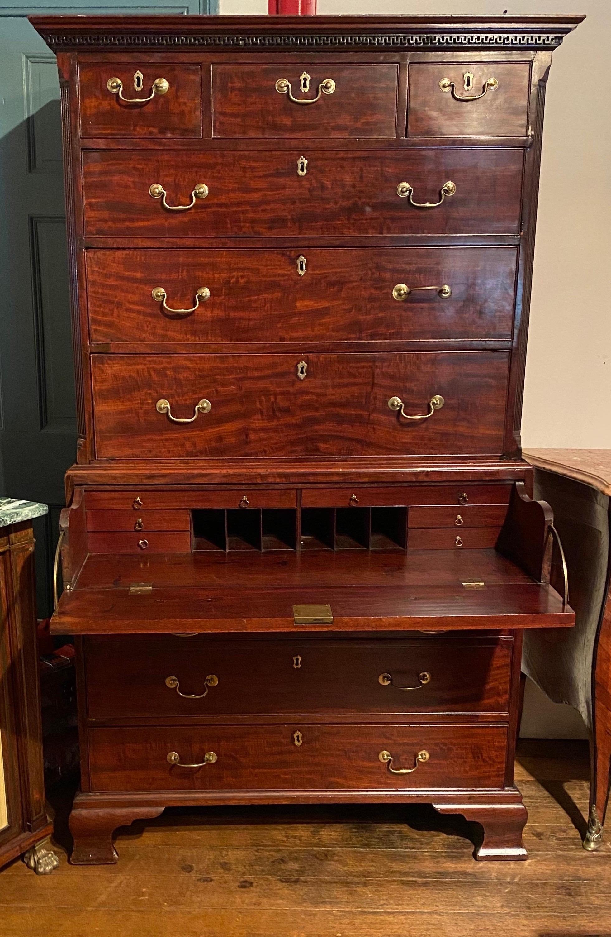 Great quality 18th century English mahogany chest on chest with a secretary desk in the top drawer of the bottom half. Corners are canted and reeded with lambs tongue and wall of troy moldings around the entire top.