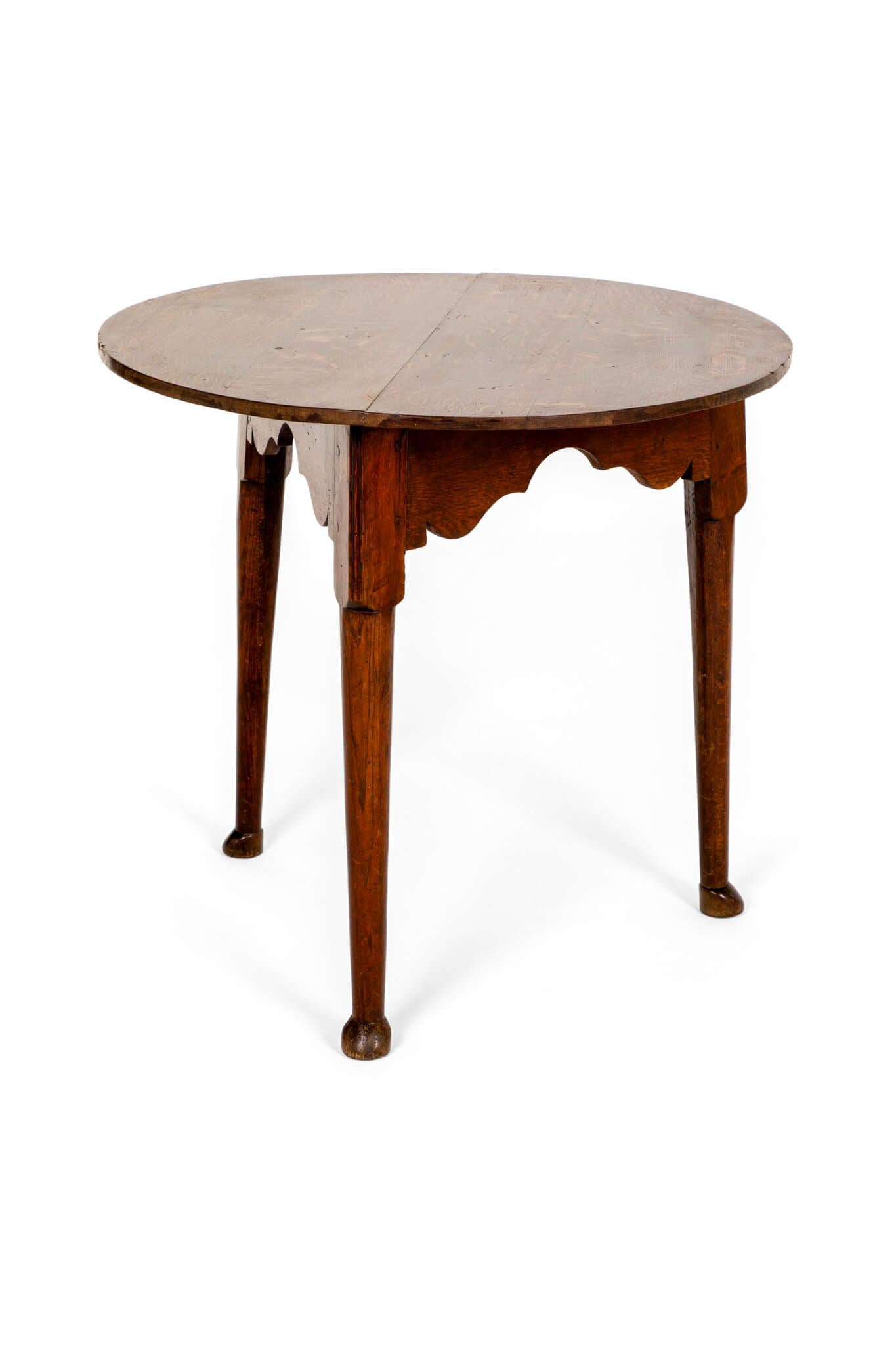 A wonderful 18th century oak and ash cricket table.

The patinated oak plank top sits atop a symmetrical waived frieze resting on gently tapering legs and raised on pad feet.

English, circa 1780.

H: 68.5 CM  H: 26.9 INCHES

W: 74 CM  W: 29.1