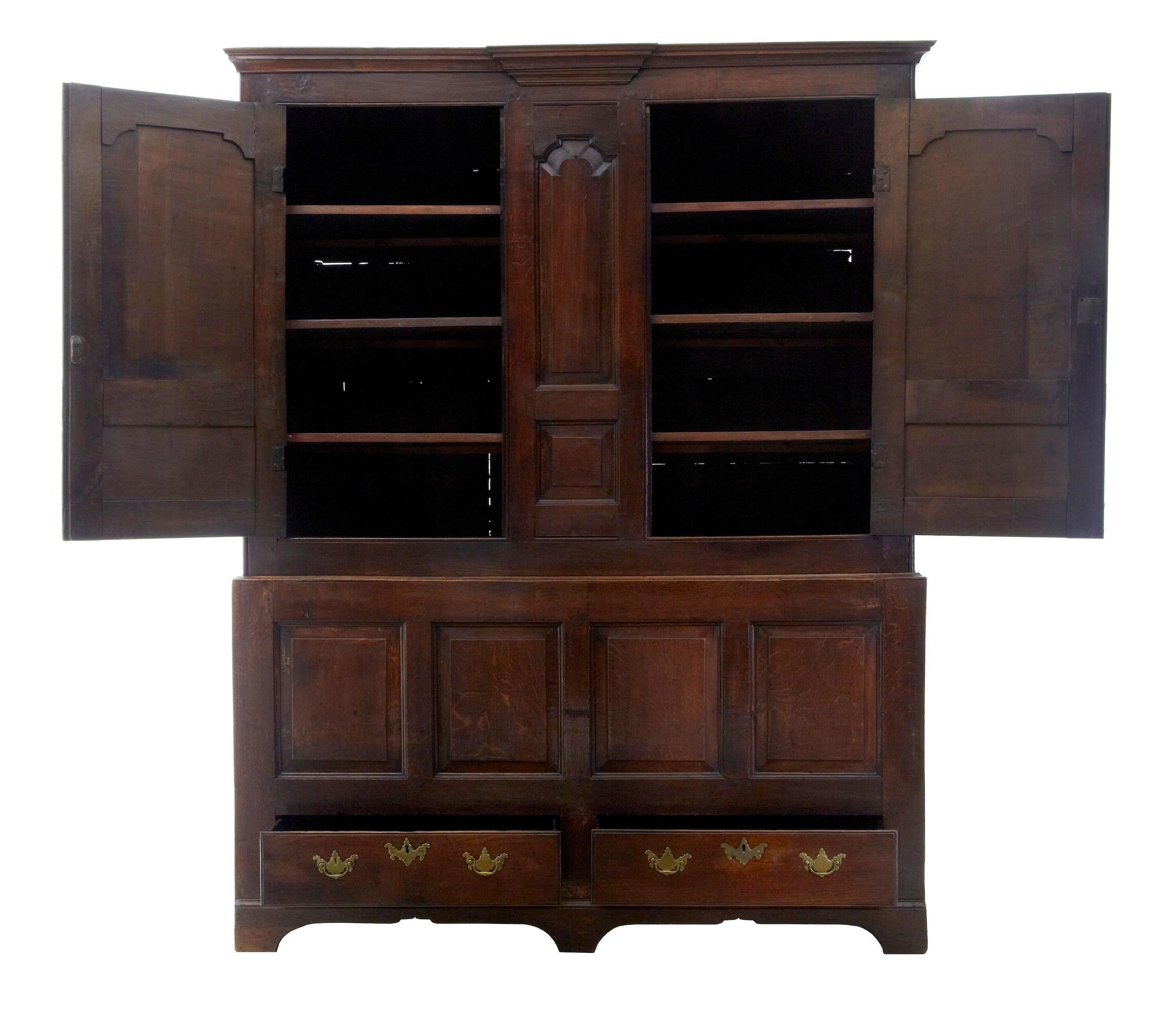 18th century English oak house keepers cupboard circa 1770.

2 part solid oak house keepers cupboard. Top section with fielded panel double doors which open to reveal 3 shelves on each side. Access to the bottom section is allowed from these