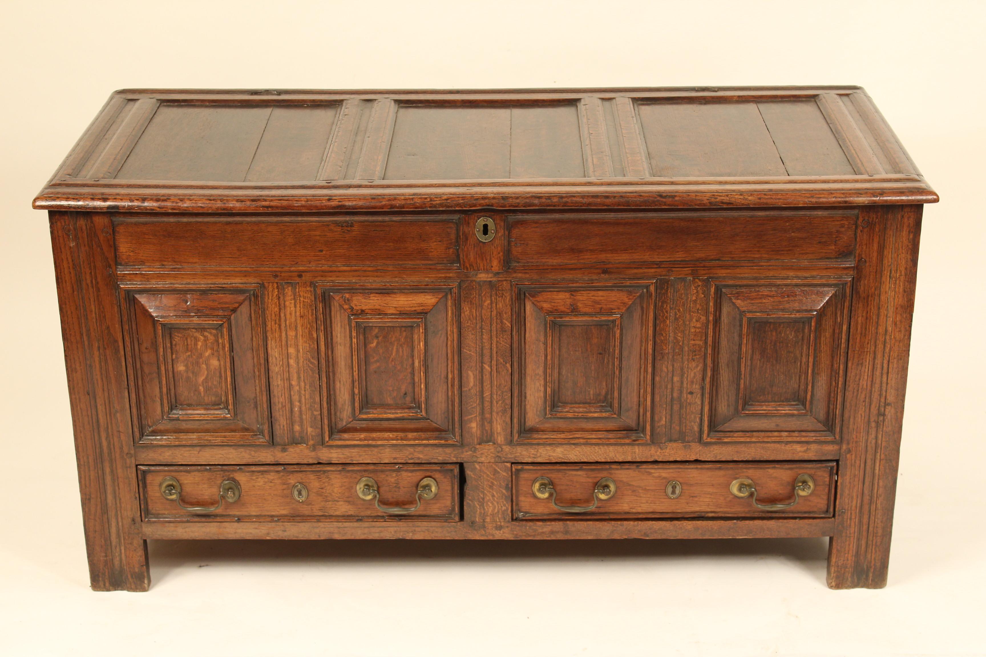 English oak trunk, 18th century. With raised front panels. Mortise and tenon construction. Excellent old patina.