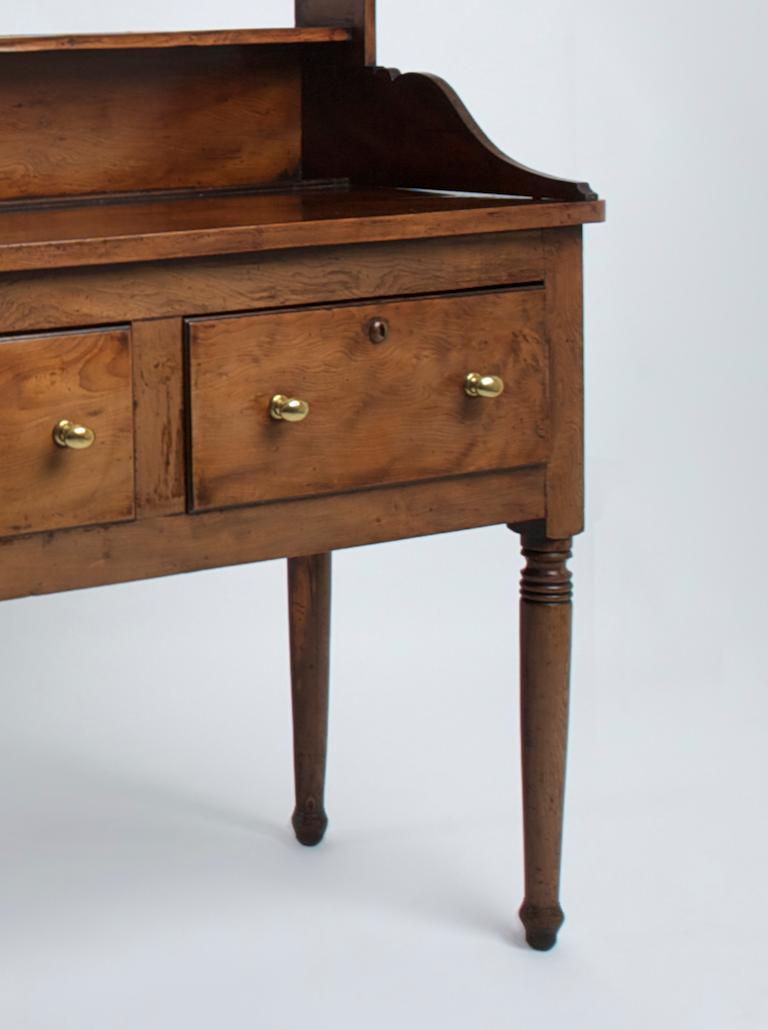 An exceptionally rare three-drawer dresser base on turned legs, of excellent color with a later associated rack. The base dates 1695-1700 and the top 1750. In beautiful condition.