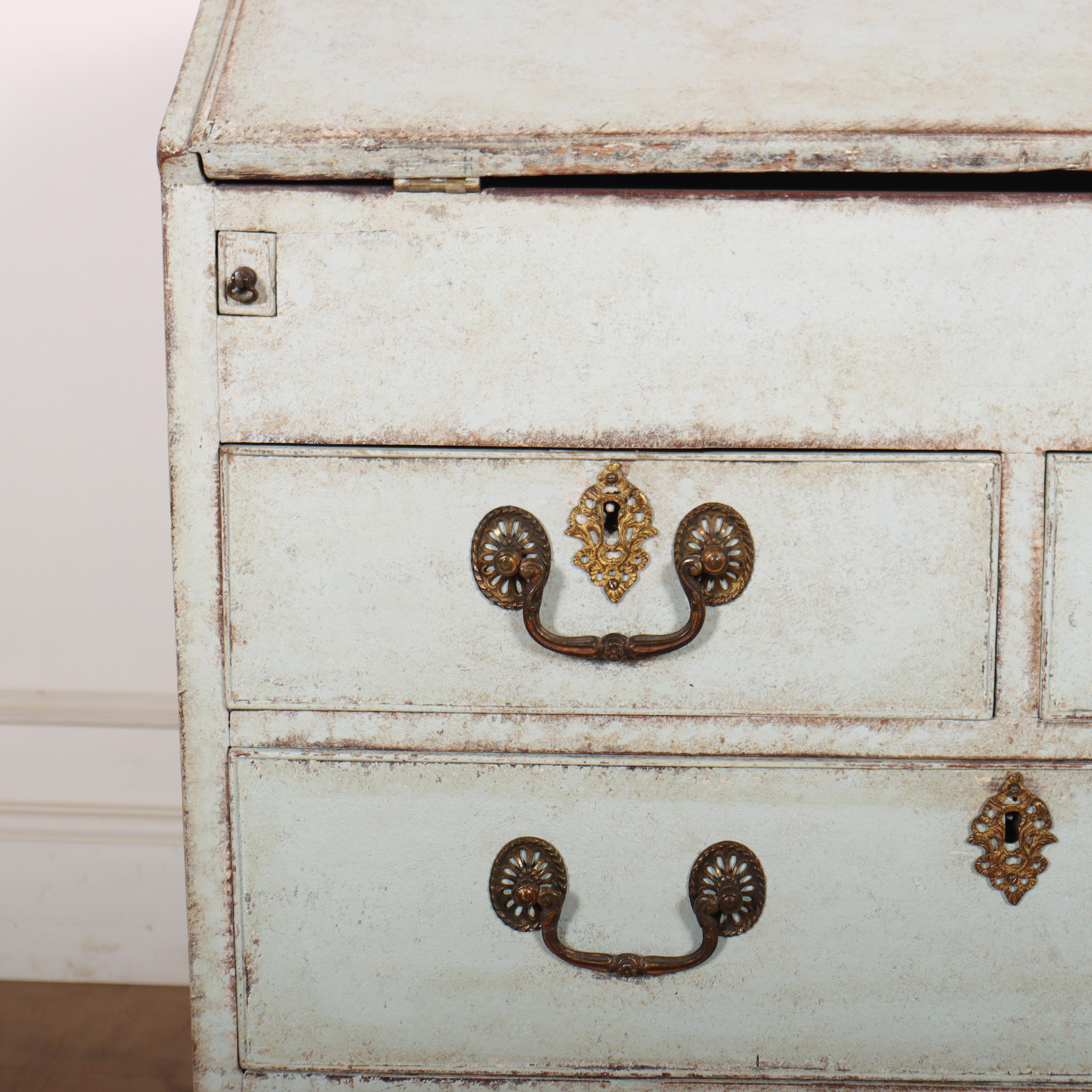 Pretty 18th century narrow painted bureau with a fitted interior and working lock and key. The interior features a hidden well and a lovely original chinoiserie lacquer. 1790.

Height to the underside of the fall front is 69cm.

Code: