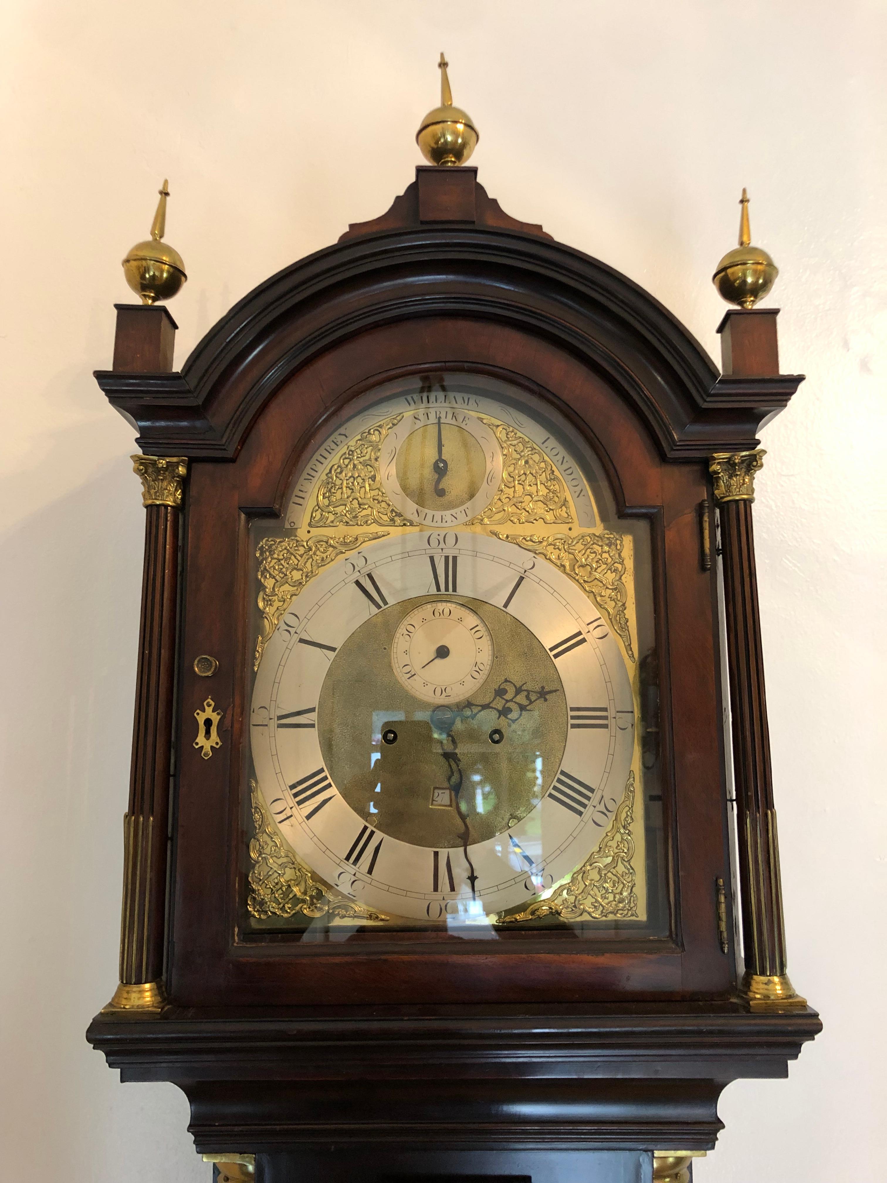 Handsome and elegant tall case grandfather clock in beautiful rich plum mahogany, difficult to capture in photographs. With pierced brass and steel face. Date and second dials. 

By Humphrey Williams London, circa 1780. Humphrey Williams listed in