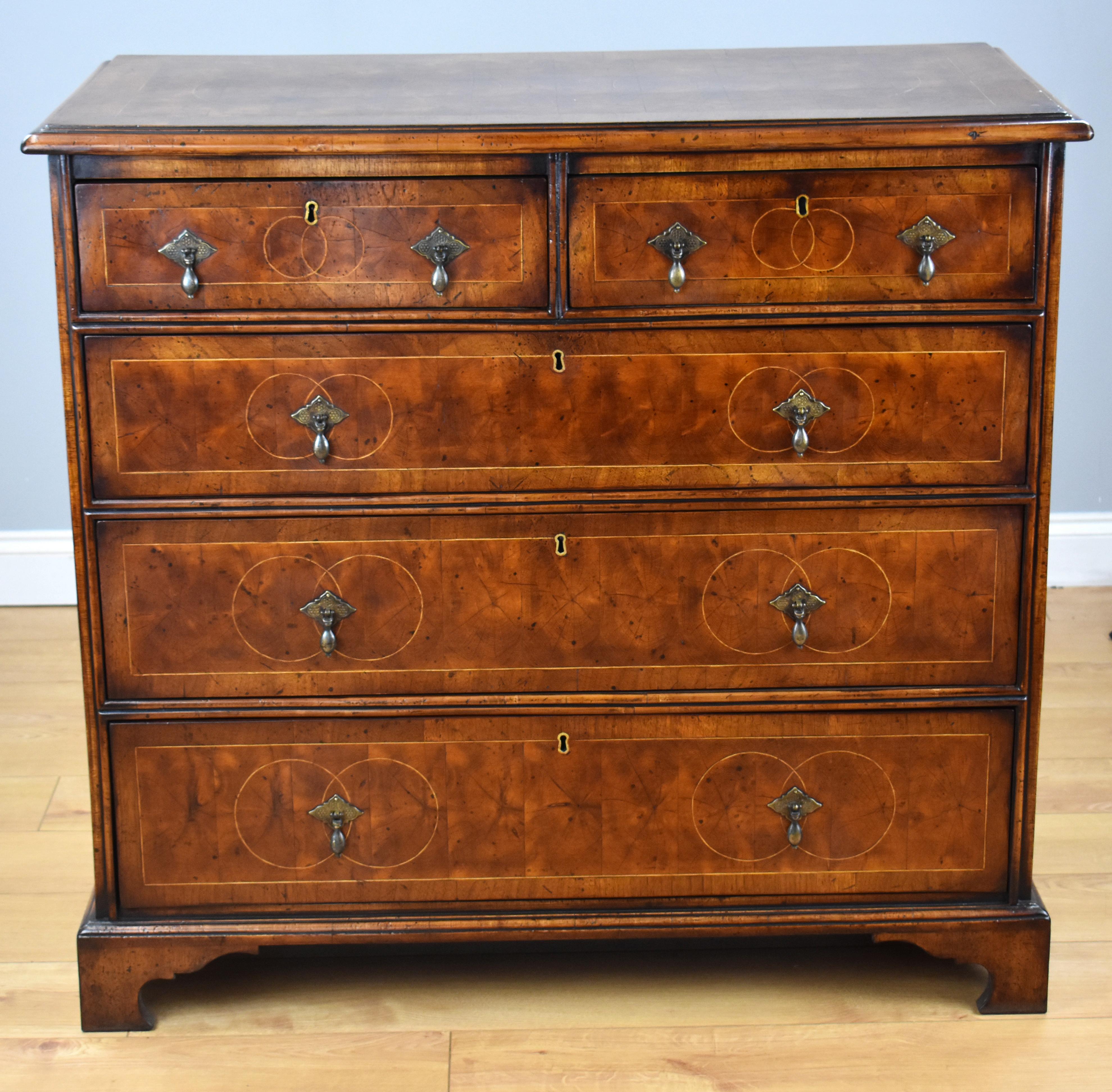 For sale is a good quality 18th century walnut and oyster veneer chest of drawers, the top inlaid with white line circles above an arrangement of five drawers (two short over three long) each oyster veneered and inlaid. The chest stands on bracket