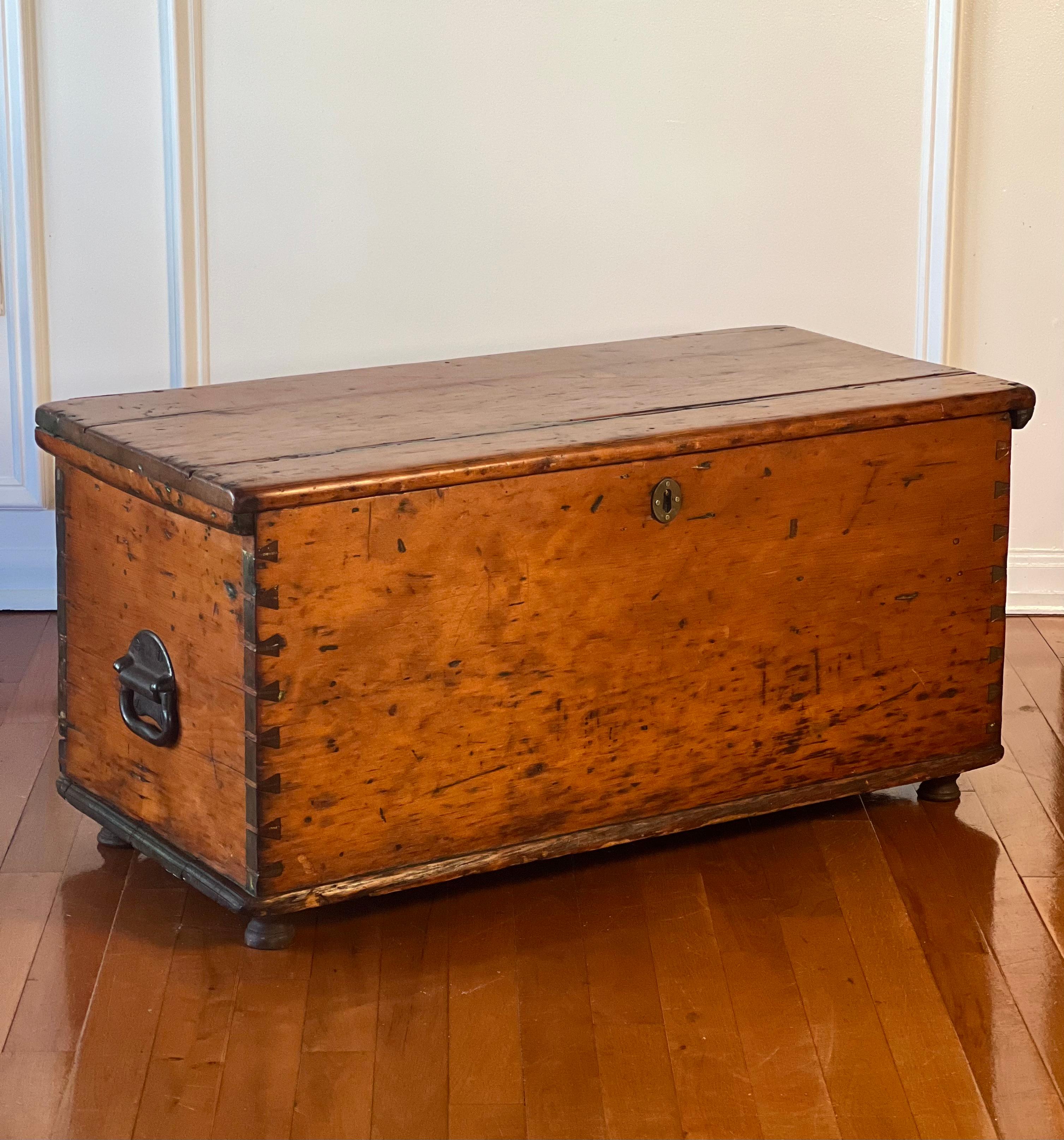 Primitive dovetailed pine chest or coffer, Europe, late 18th century.

Likely Austrian or German, this rustic European, hand-crafted chest is loaded with character and has a wonderful, weathered patina with a time-worn glow. It has dovetail