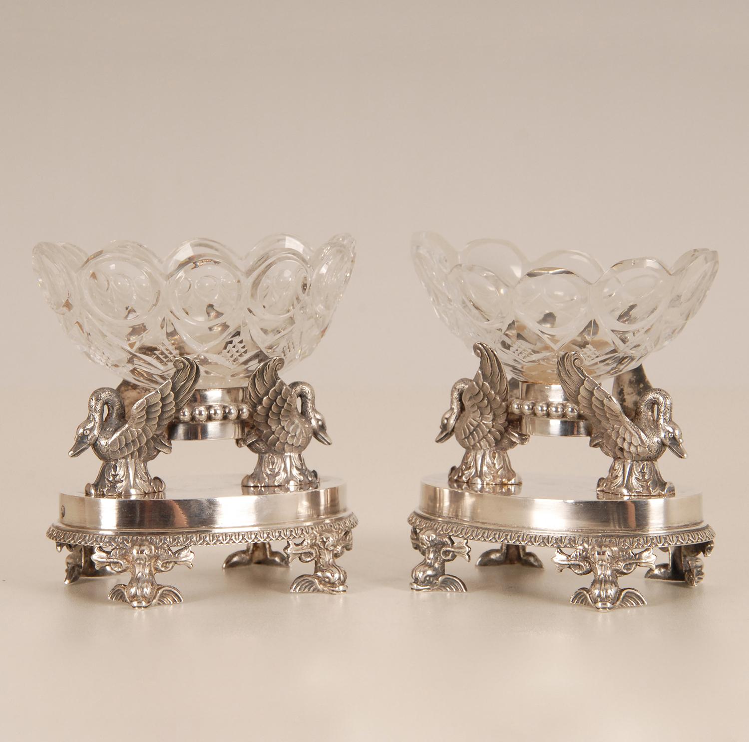 18th Century Museal French masterpieces.
A pair sterling silver and Baccarat crystal salt cellars.
The 2 oval crystal bowls carried by 2 Swans on
an oval base supported by 4 Dolphins
Hallmarkes French sterling Silver 950, Paris, Marks for the