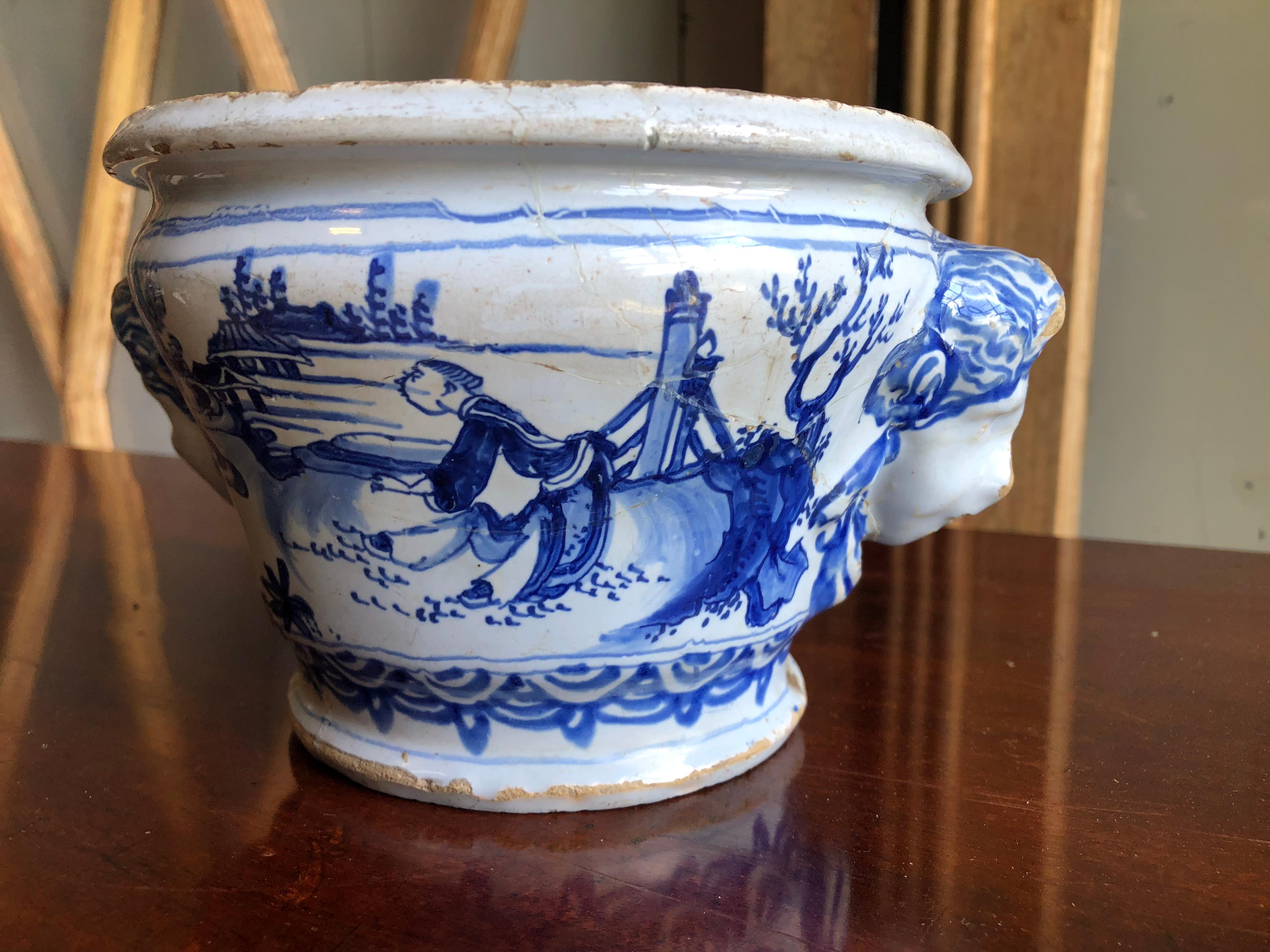 An 18th century French faience cachepot from Nevers, with blue chinoiserie decoration and masks on each side, circa 1750. 


  